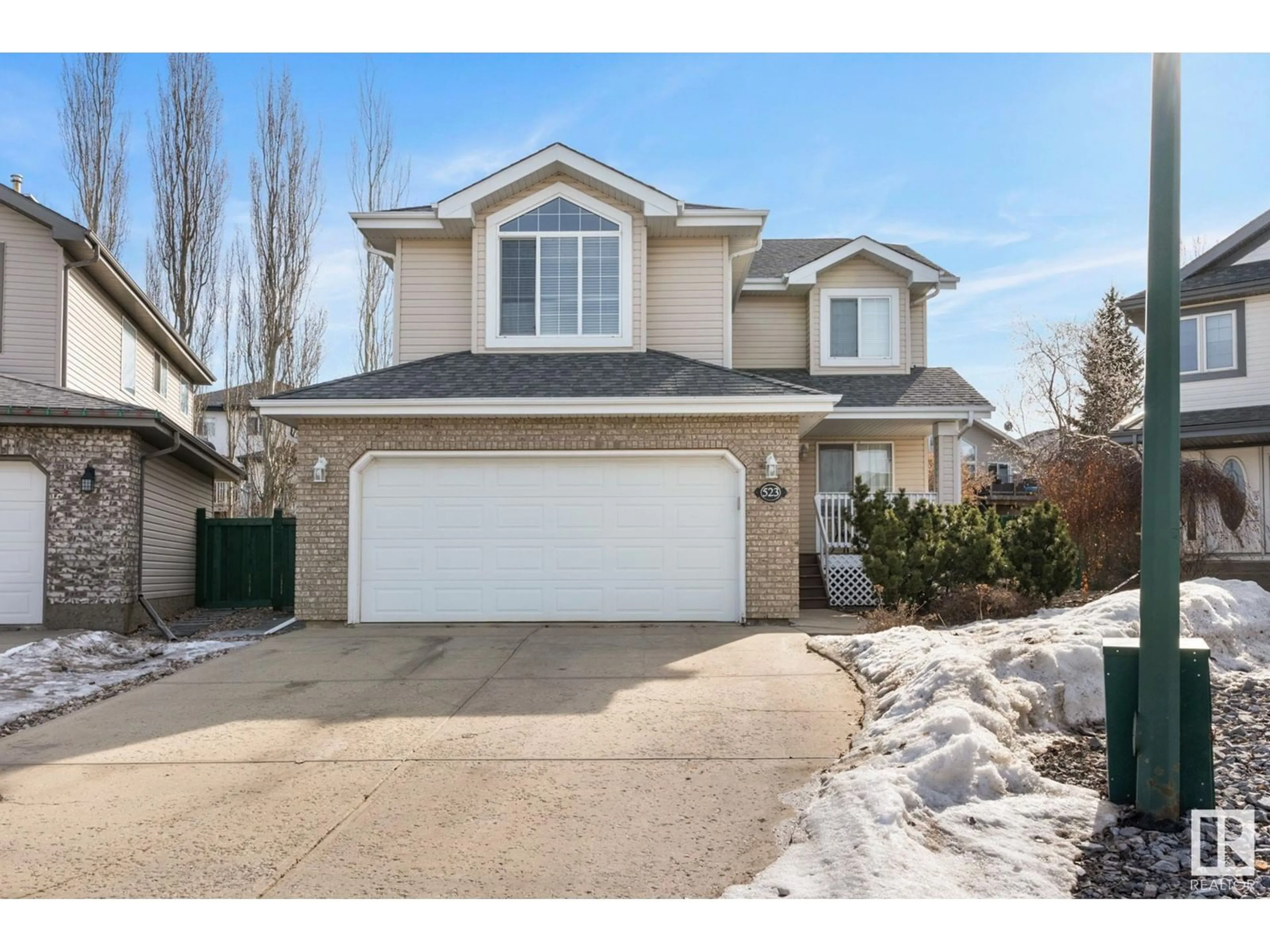 Home with vinyl exterior material, street for 523 HUNTERS GR, Edmonton Alberta T6R3B6