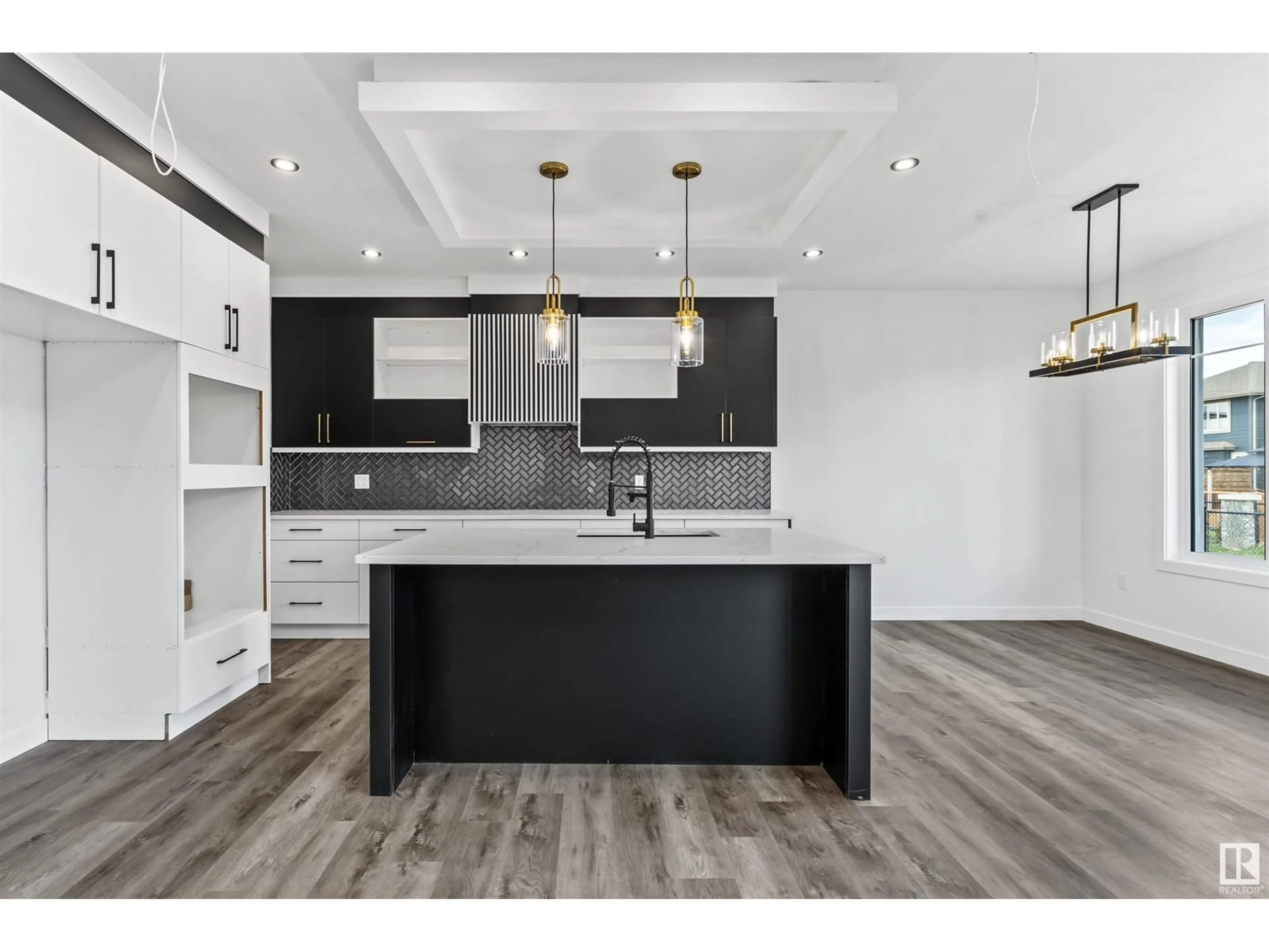 Open concept kitchen, wood/laminate floor for 210 CRYSTAL CREEK DRIVE, Leduc Alberta T9E1N3