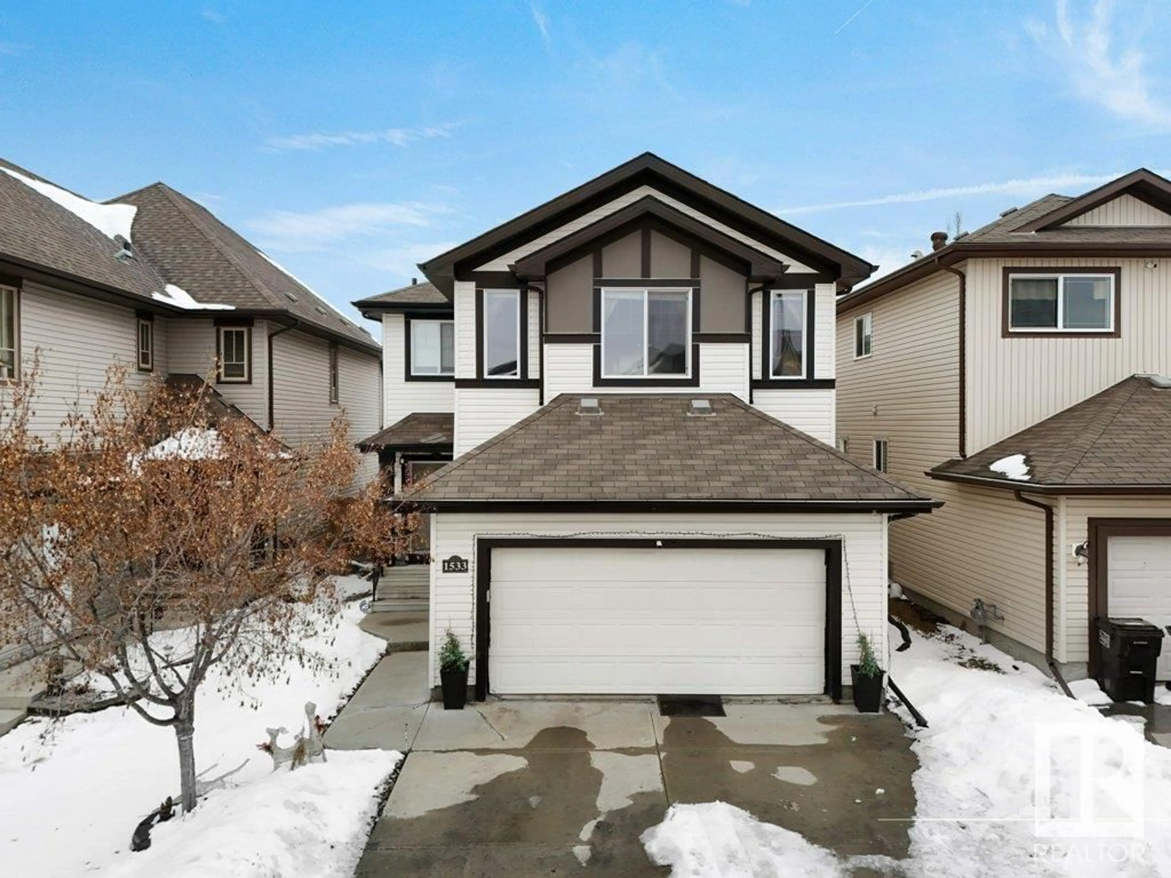 Home with vinyl exterior material, street for NW - 1533 36B AV, Edmonton Alberta T6T0M4