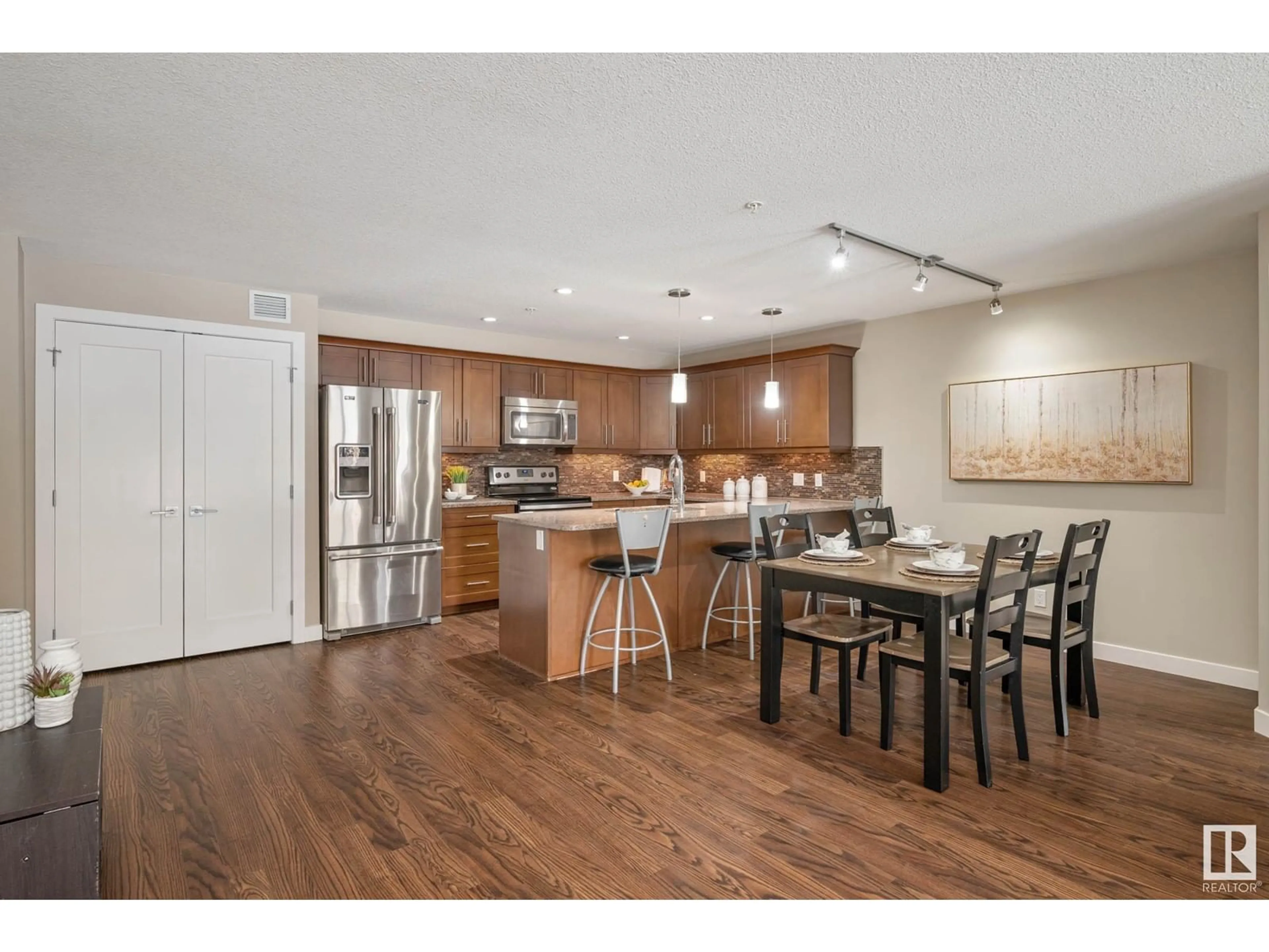 Open concept kitchen, wood/laminate floor for 119 1031 173 ST, Edmonton Alberta T6W3E4