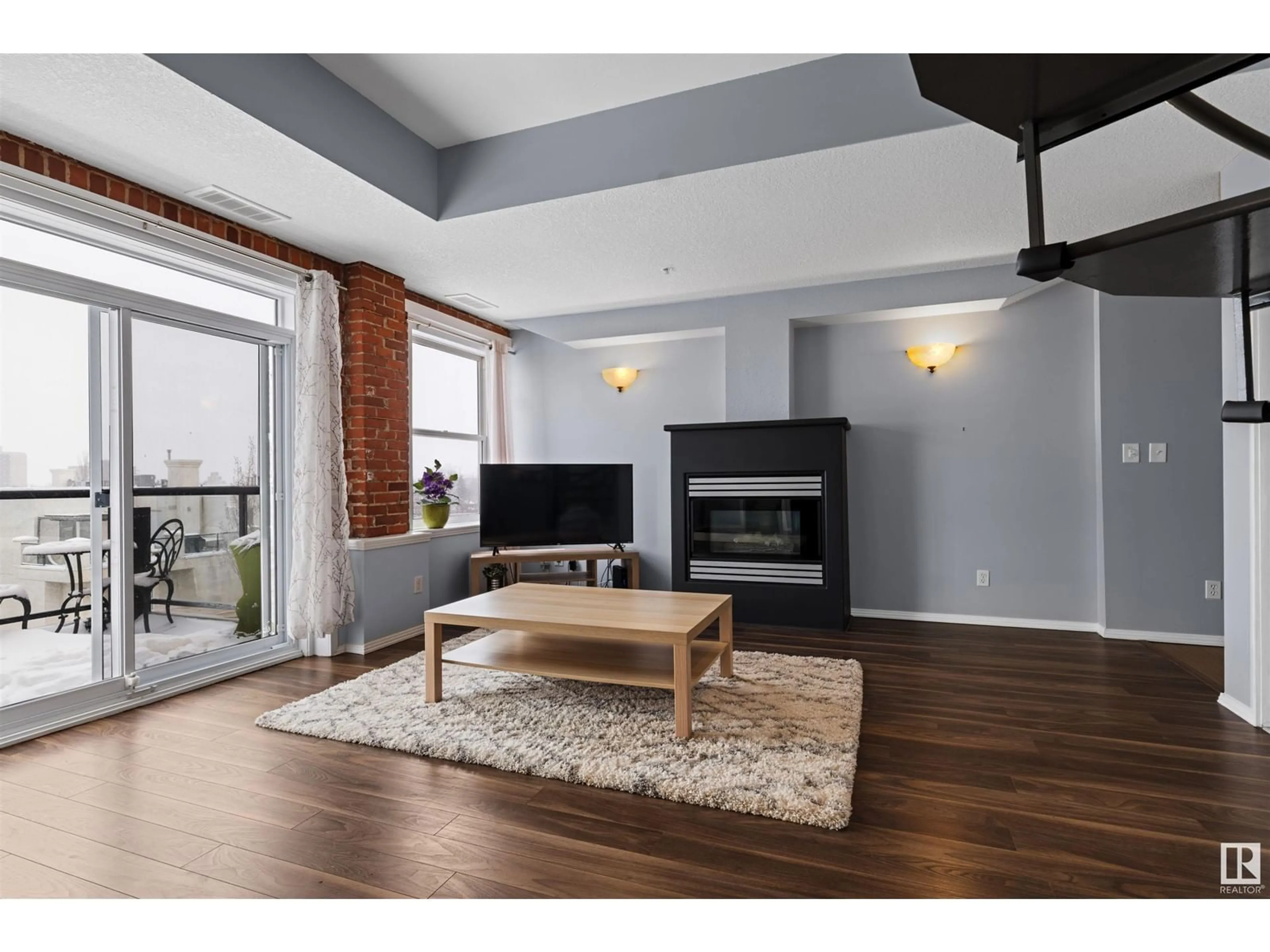 Living room with furniture, wood/laminate floor for #505 - 10728 82 AV, Edmonton Alberta T6E6P5