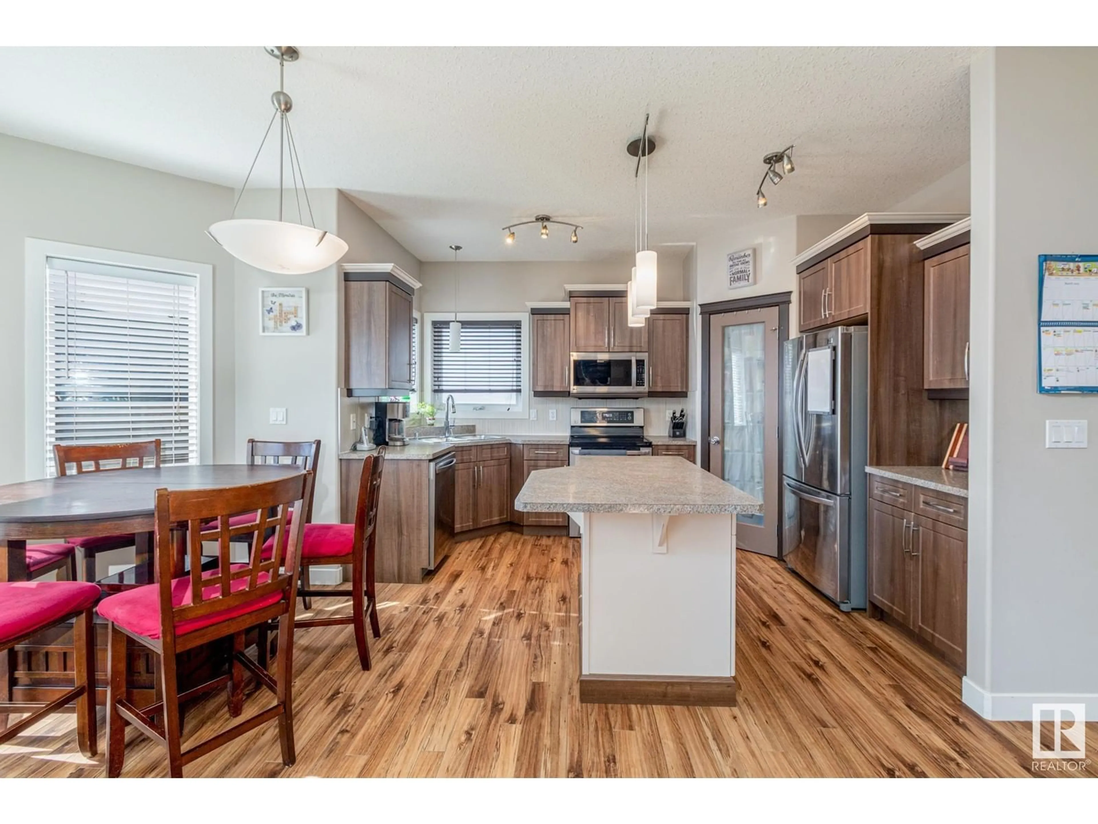 Open concept kitchen, wood/laminate floor for 10409 95 ST, Morinville Alberta T8R0B2