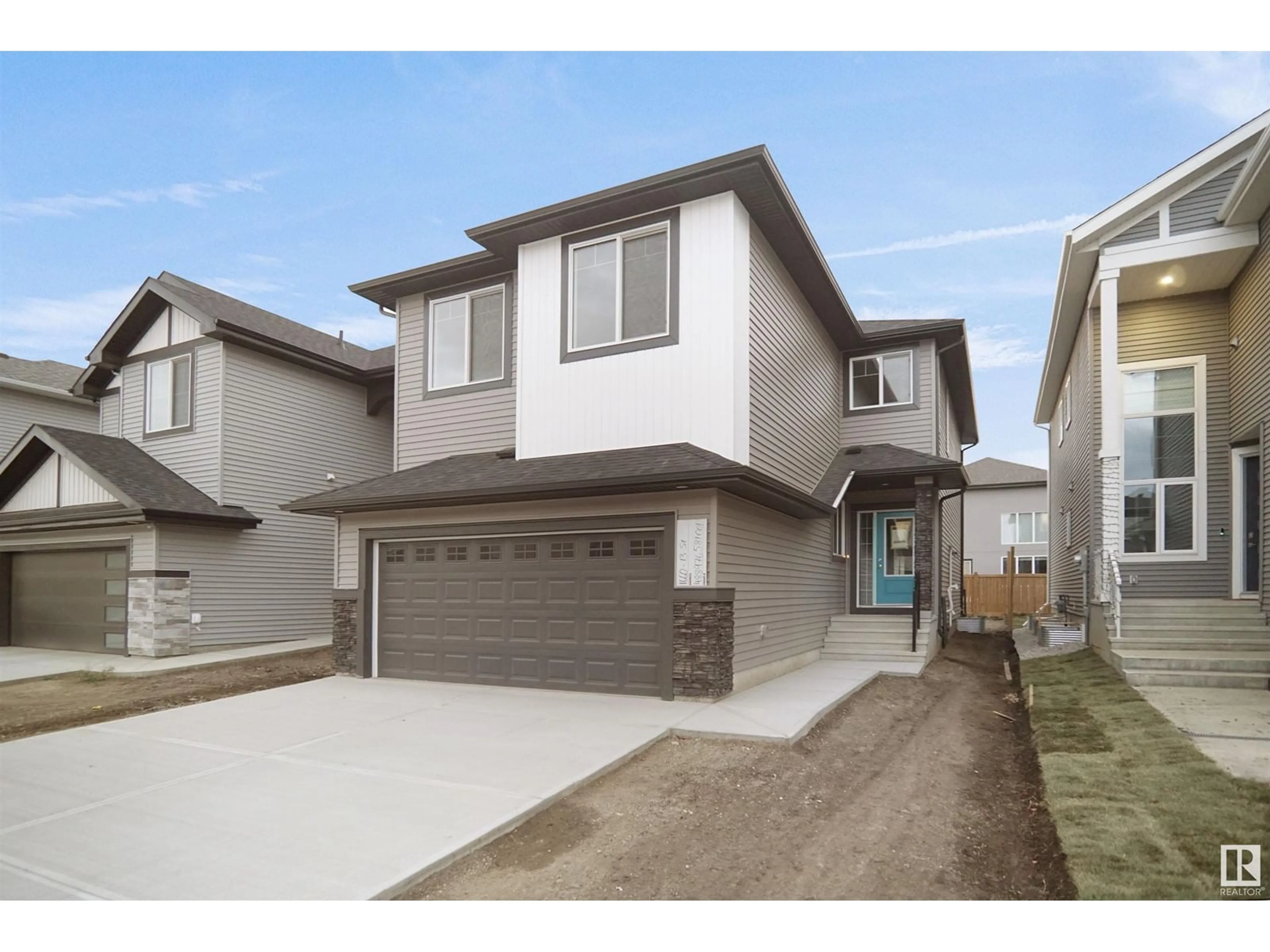 Home with vinyl exterior material, street for 2603 15 AV, Edmonton Alberta T6T2N5