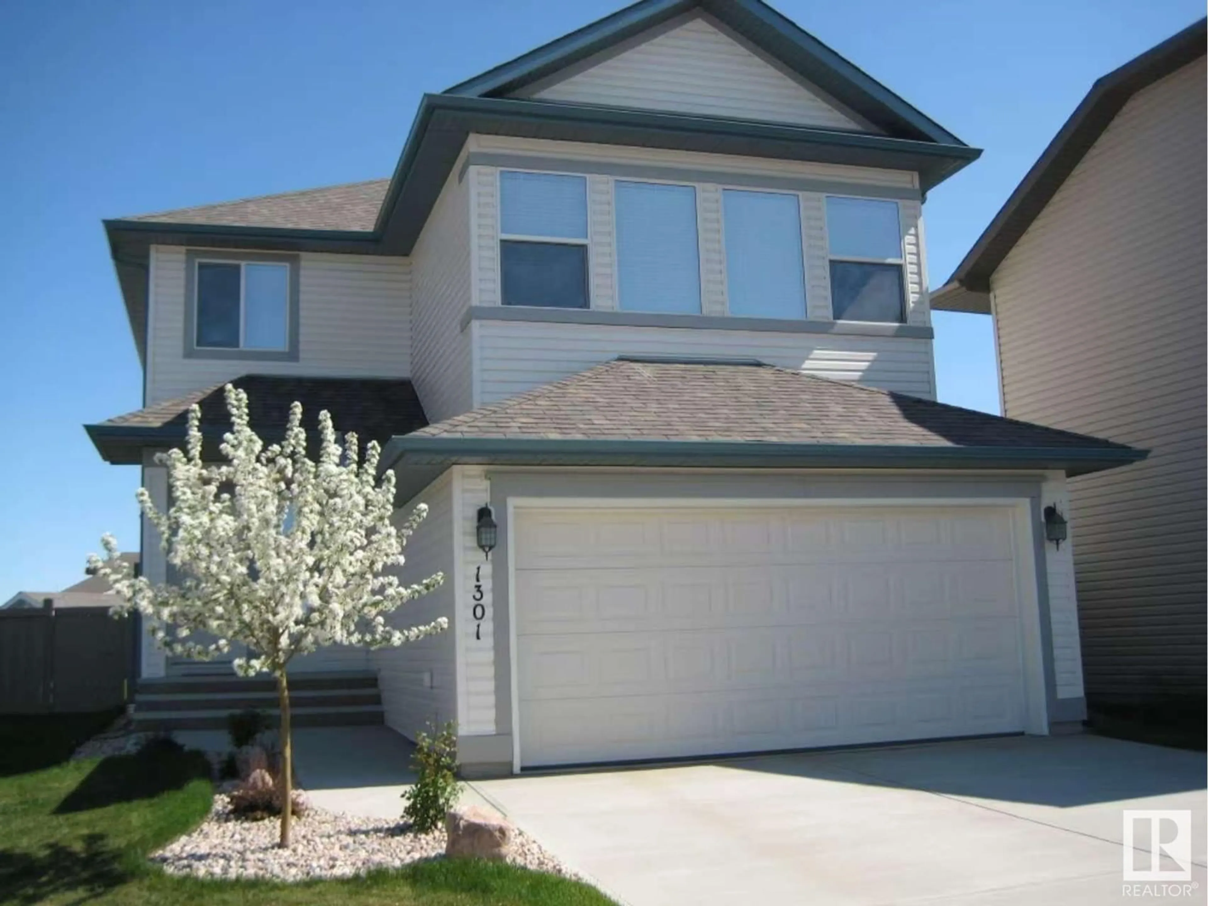 Home with vinyl exterior material, street for 1301 MCALLISTER WY, Edmonton Alberta T6W0B1