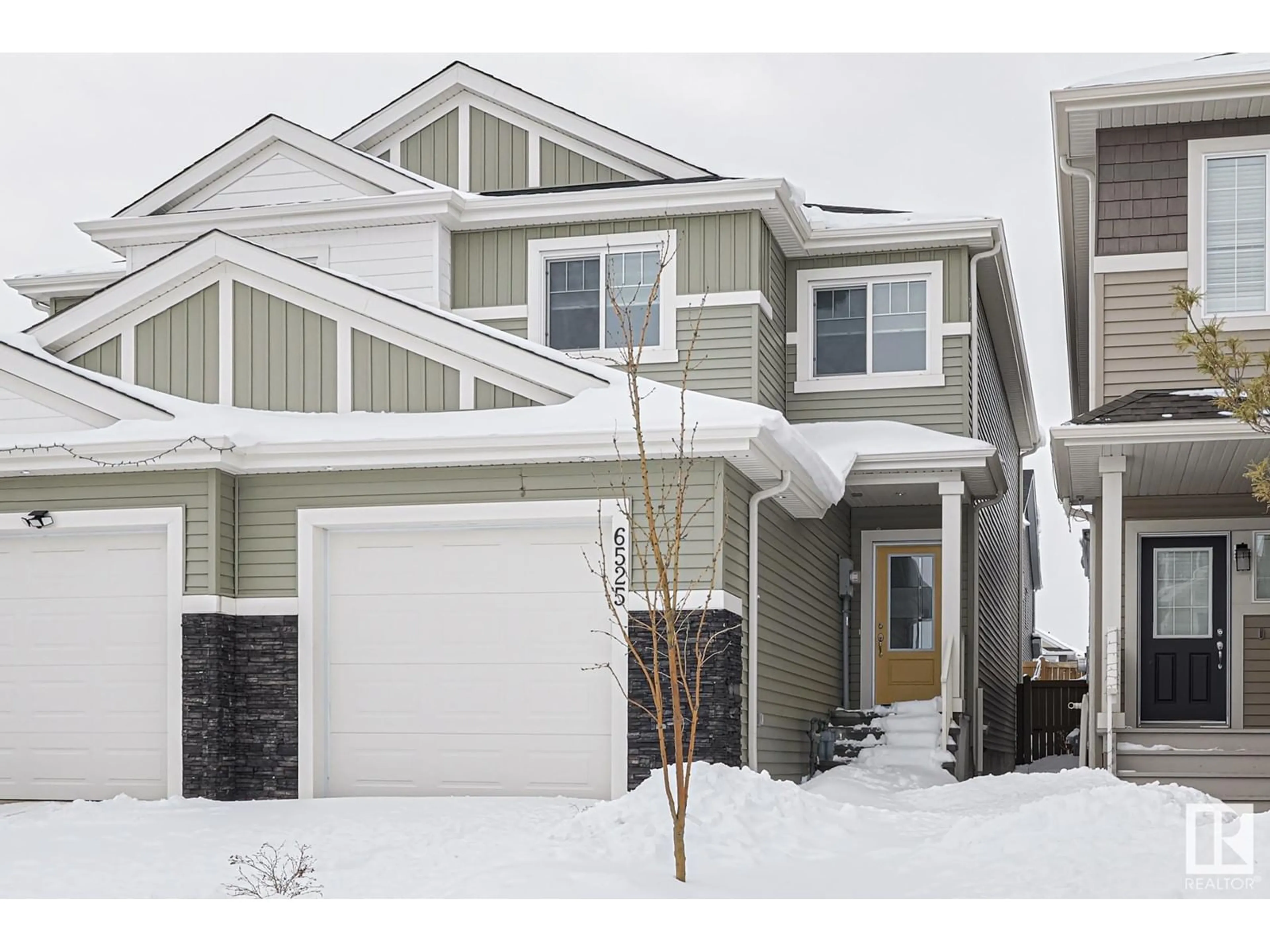 Home with vinyl exterior material, street for NW - 6525 167B AV, Edmonton Alberta T5Y3X8