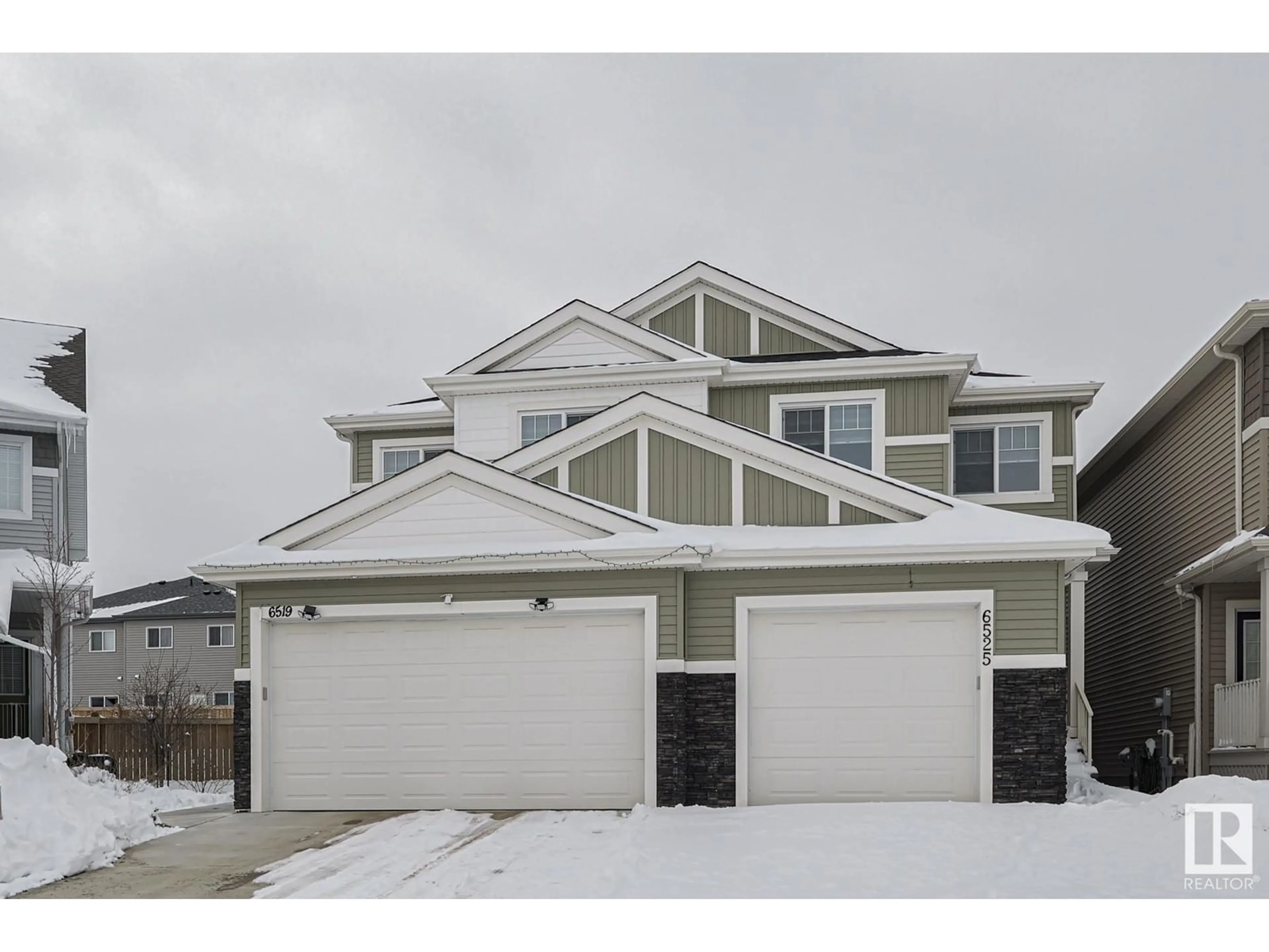 Home with vinyl exterior material, street for NW - 6525 167B AV, Edmonton Alberta T5Y3X8