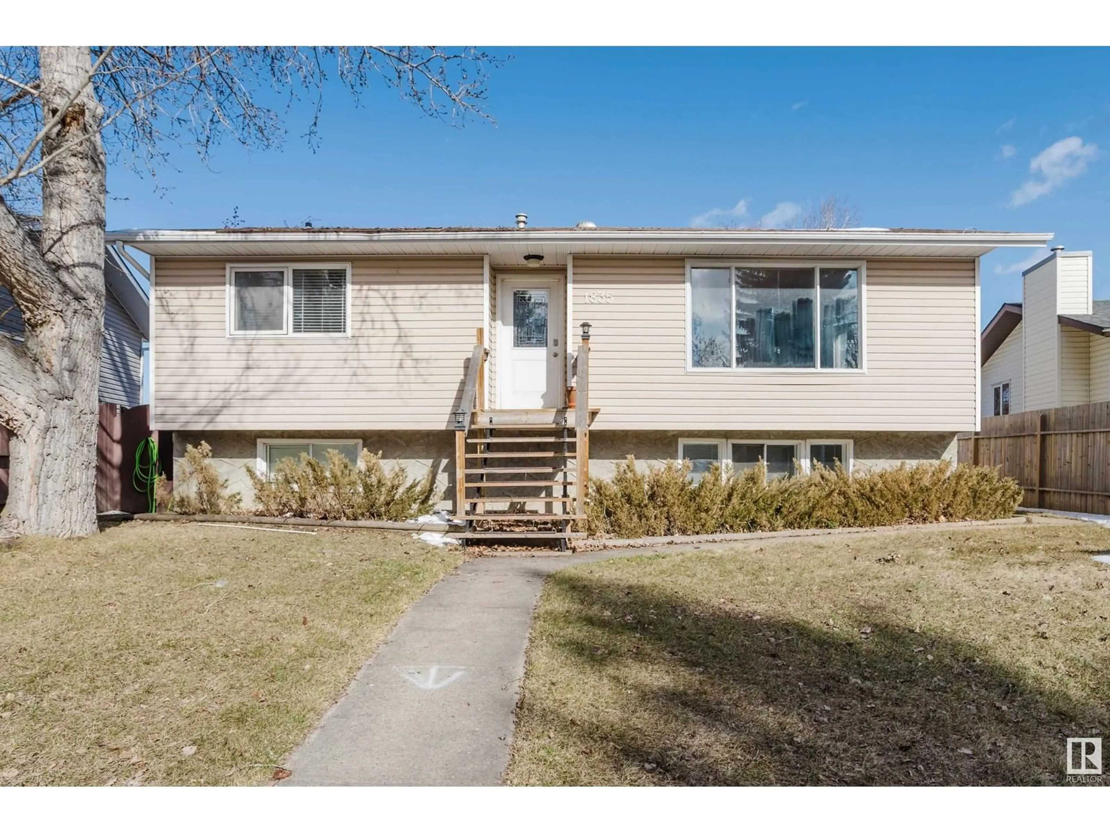 Home with vinyl exterior material, street for NW - 1835 56 ST, Edmonton Alberta T6L1L6