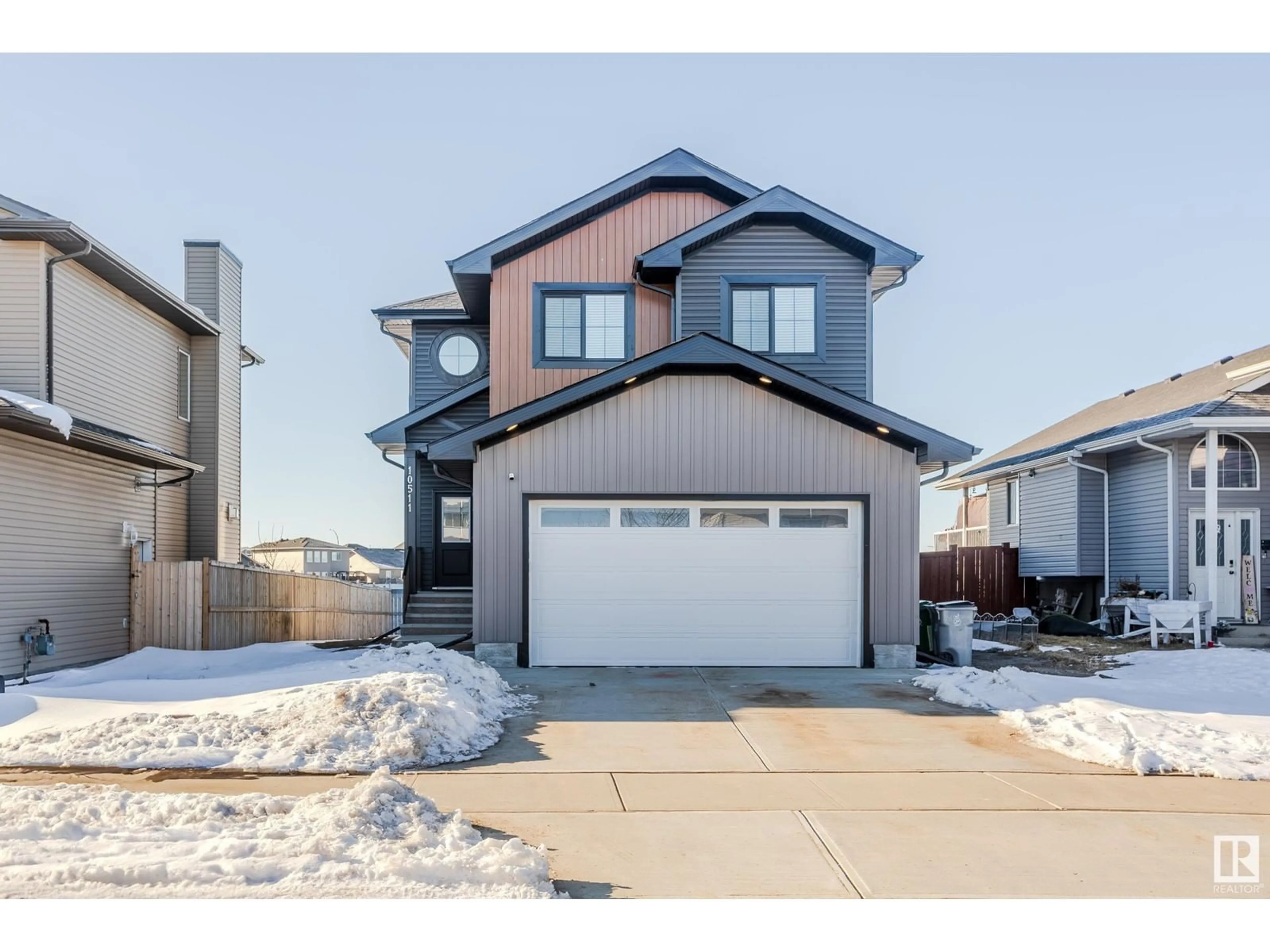 Home with vinyl exterior material, street for 10511 106 AV, Morinville Alberta T8R0C9