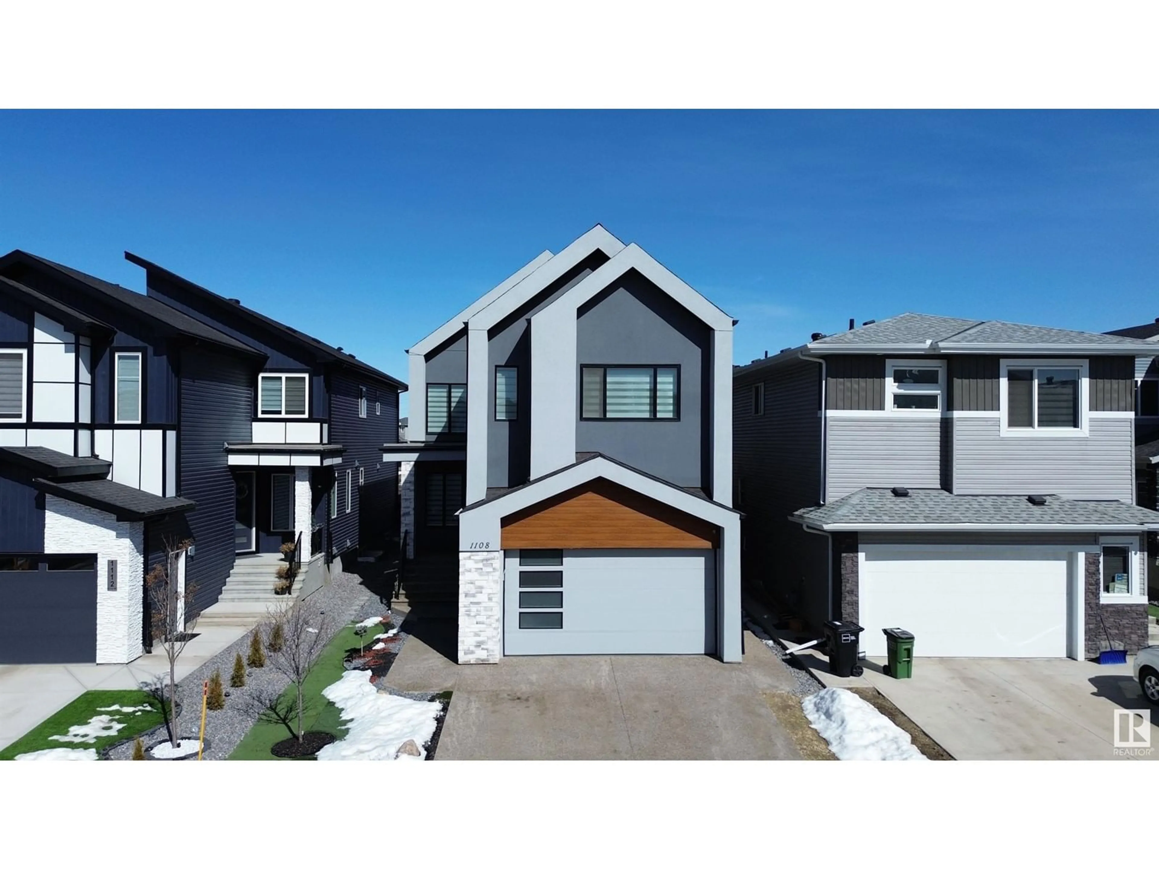 Home with vinyl exterior material, street for 1108 150 AV, Edmonton Alberta T5Y4C1