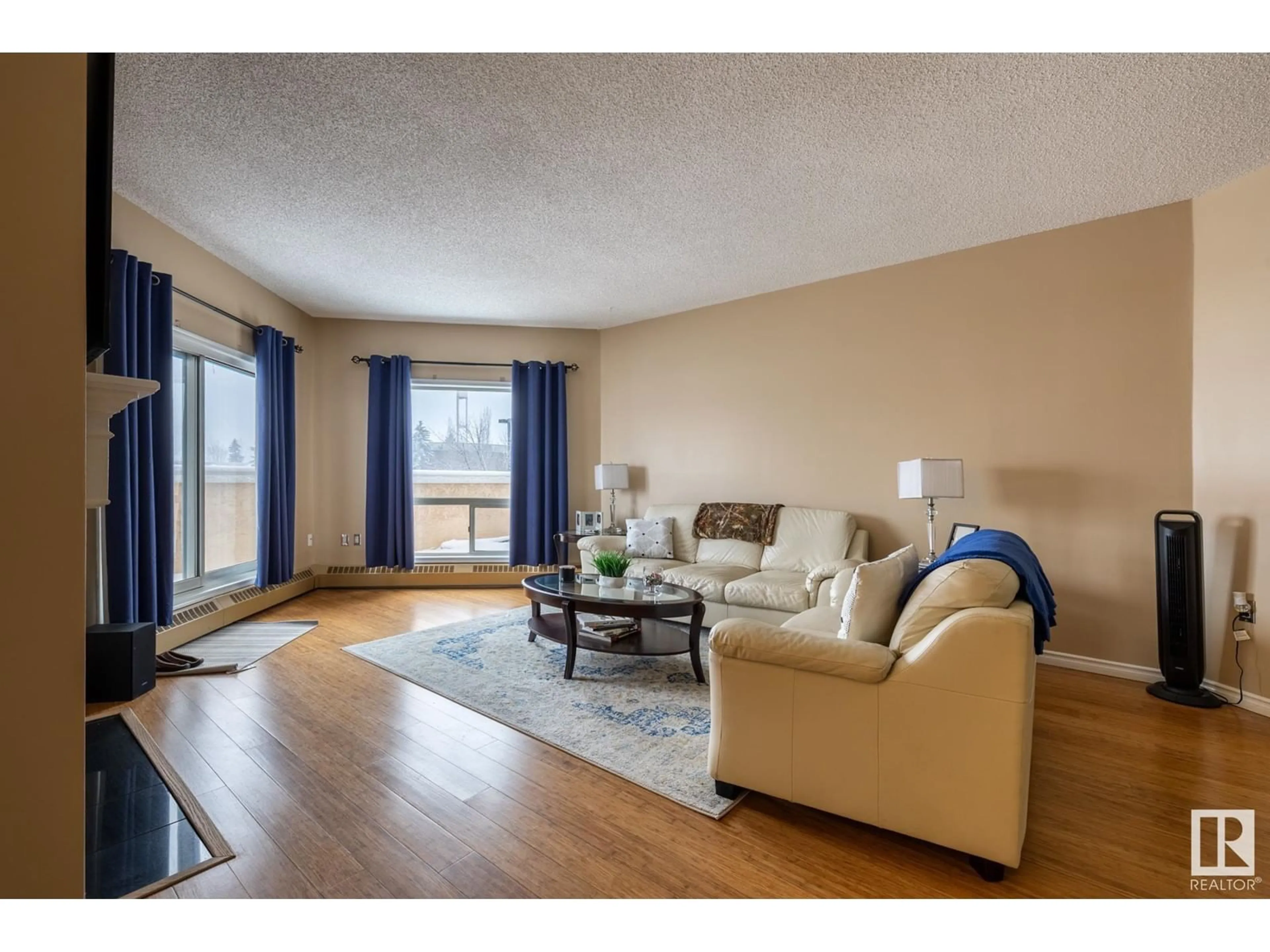 Living room with furniture, wood/laminate floor for 15499 - 236 CASTLE DOWNS RD, Edmonton Alberta T5X5Y3