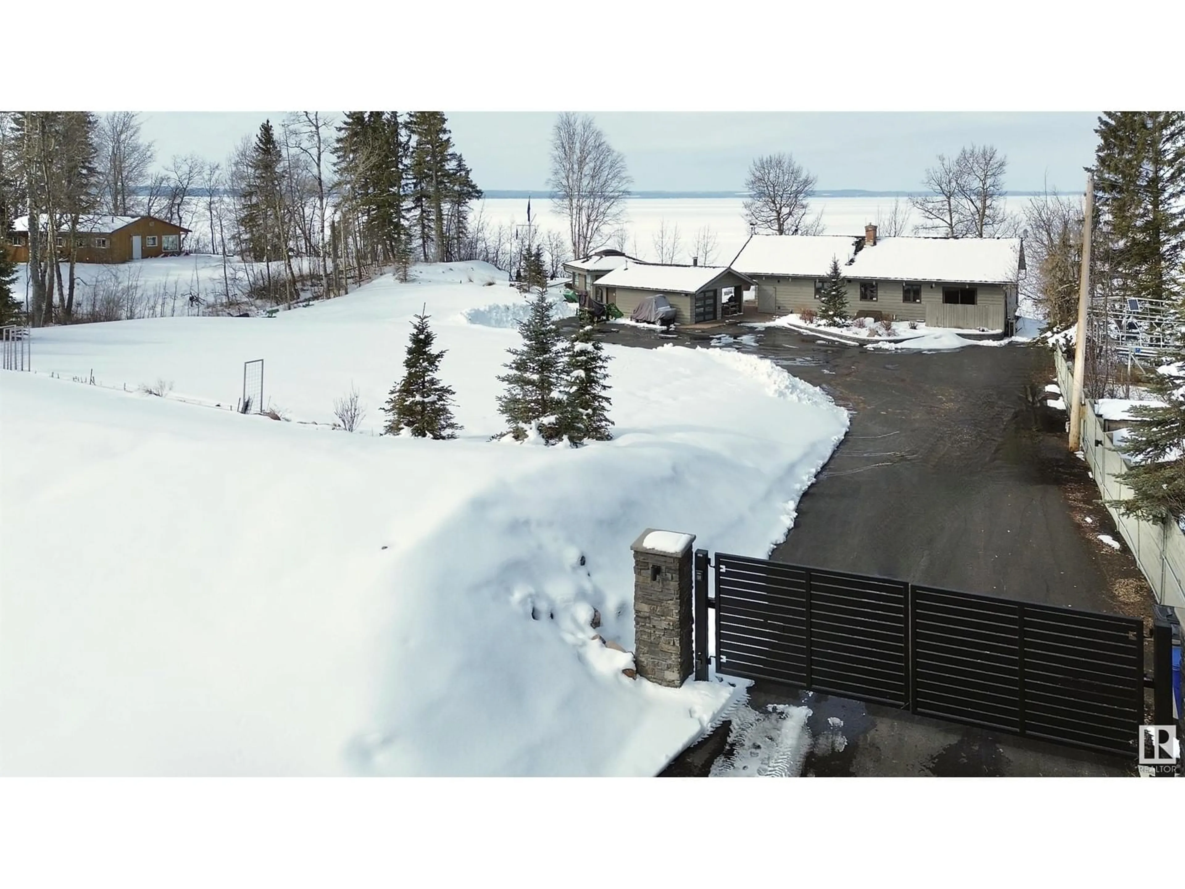 A pic from outside/outdoor area/front of a property/back of a property/a pic from drone, mountain view for 139 SILVER BEACH RD, Rural Wetaskiwin County Alberta T0C2C0