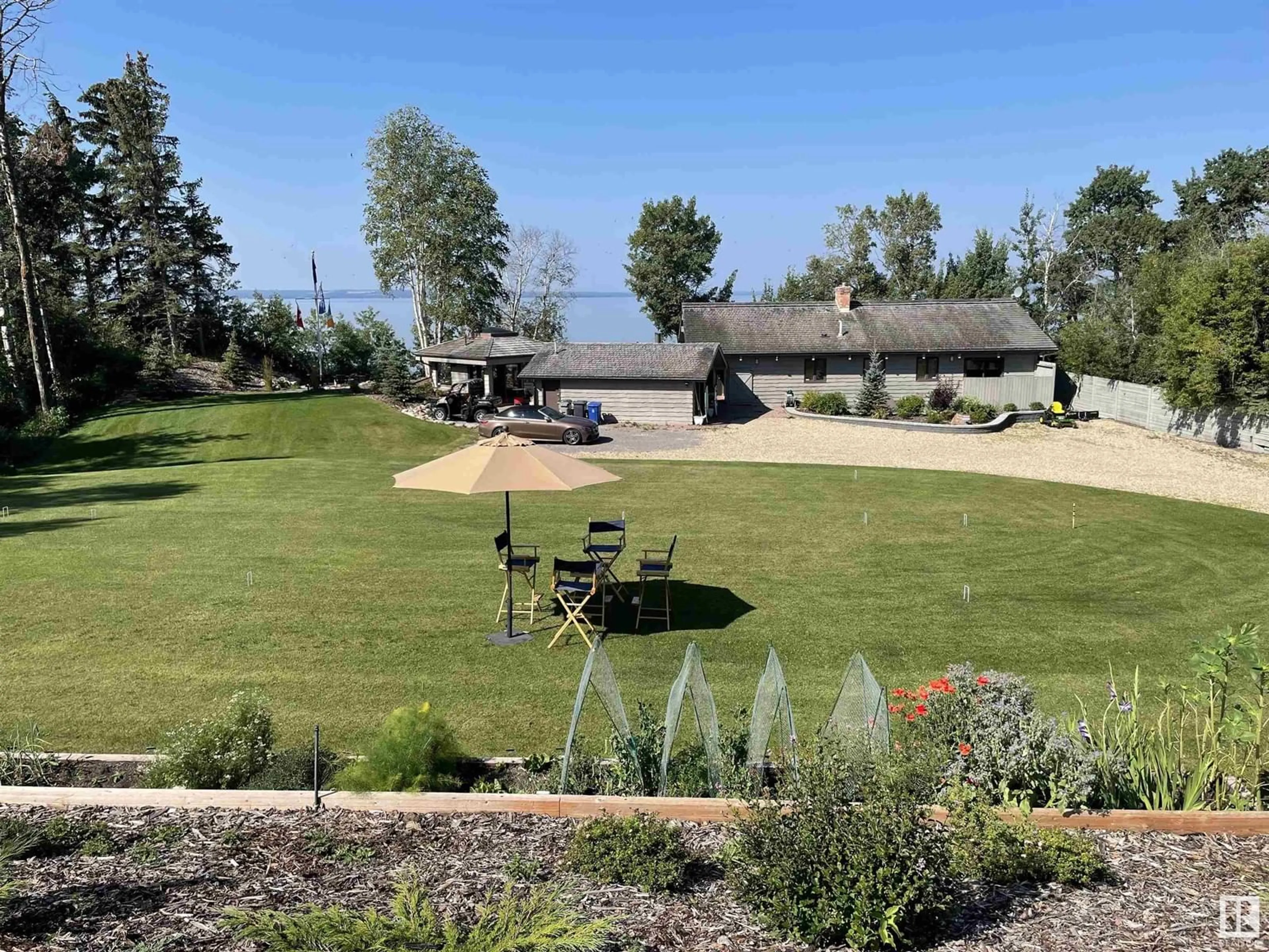 A pic from outside/outdoor area/front of a property/back of a property/a pic from drone, mountain view for 139 SILVER BEACH RD, Rural Wetaskiwin County Alberta T0C2C0