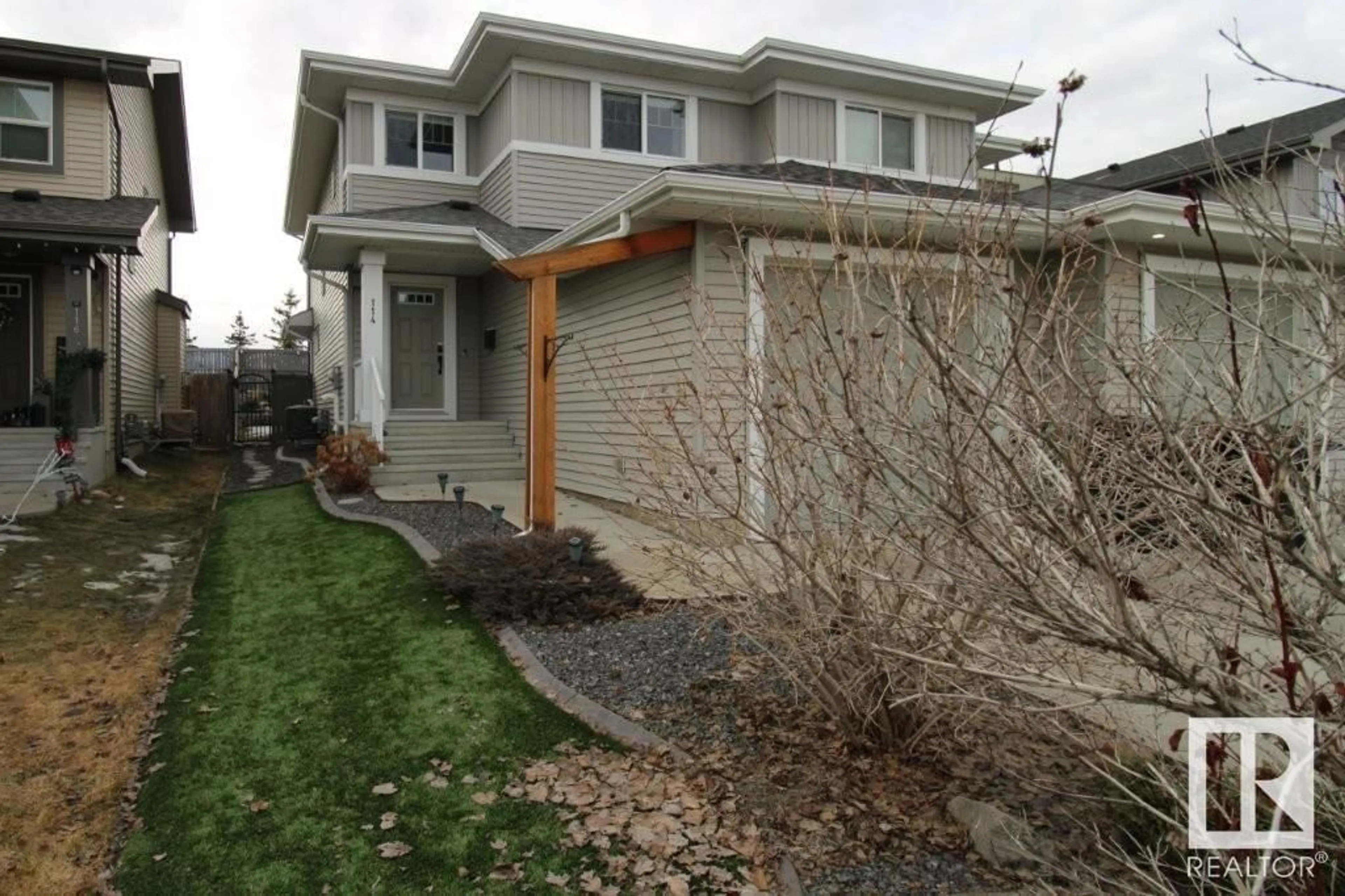 Home with vinyl exterior material, street for 114 RADCLIFFE WD, Fort Saskatchewan Alberta T8L0M6