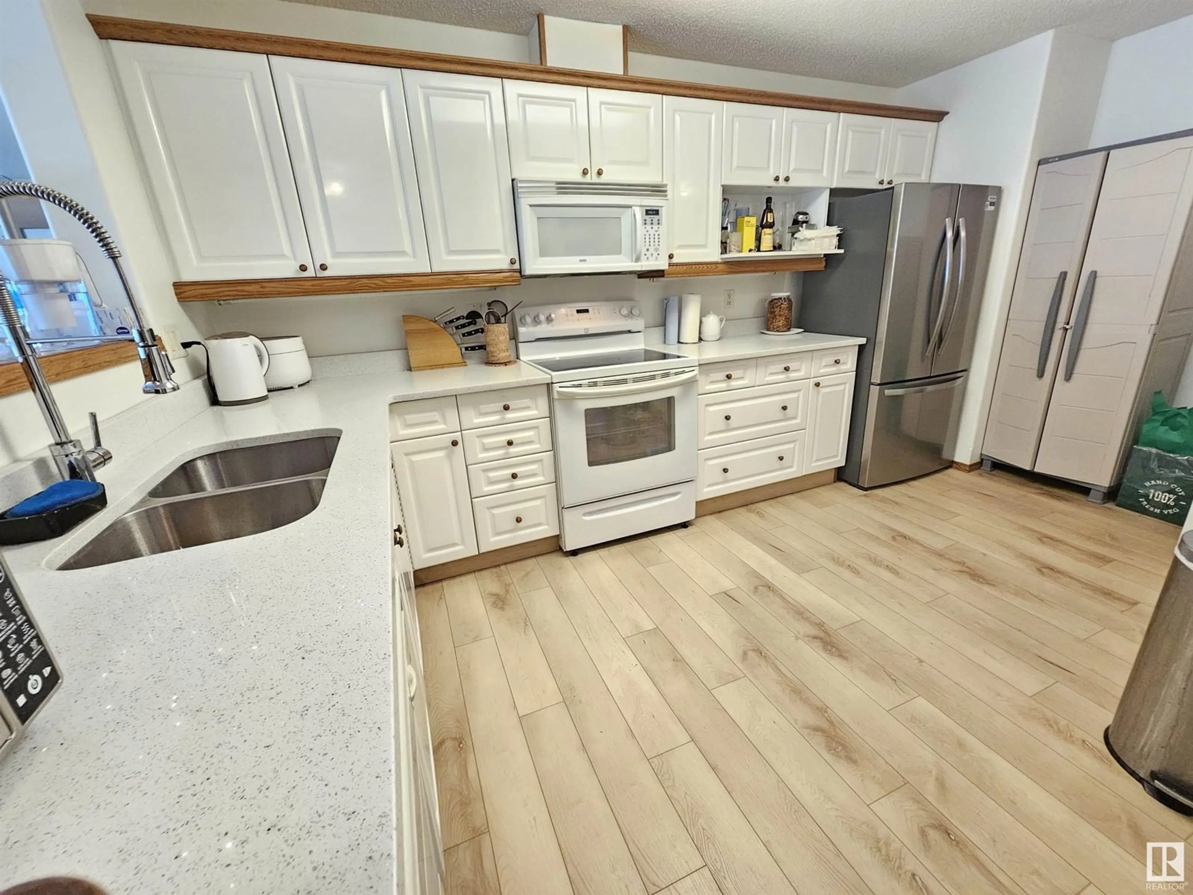 Open concept kitchen, unknown for #107 - 7839 96 ST, Edmonton Alberta T6C4R3