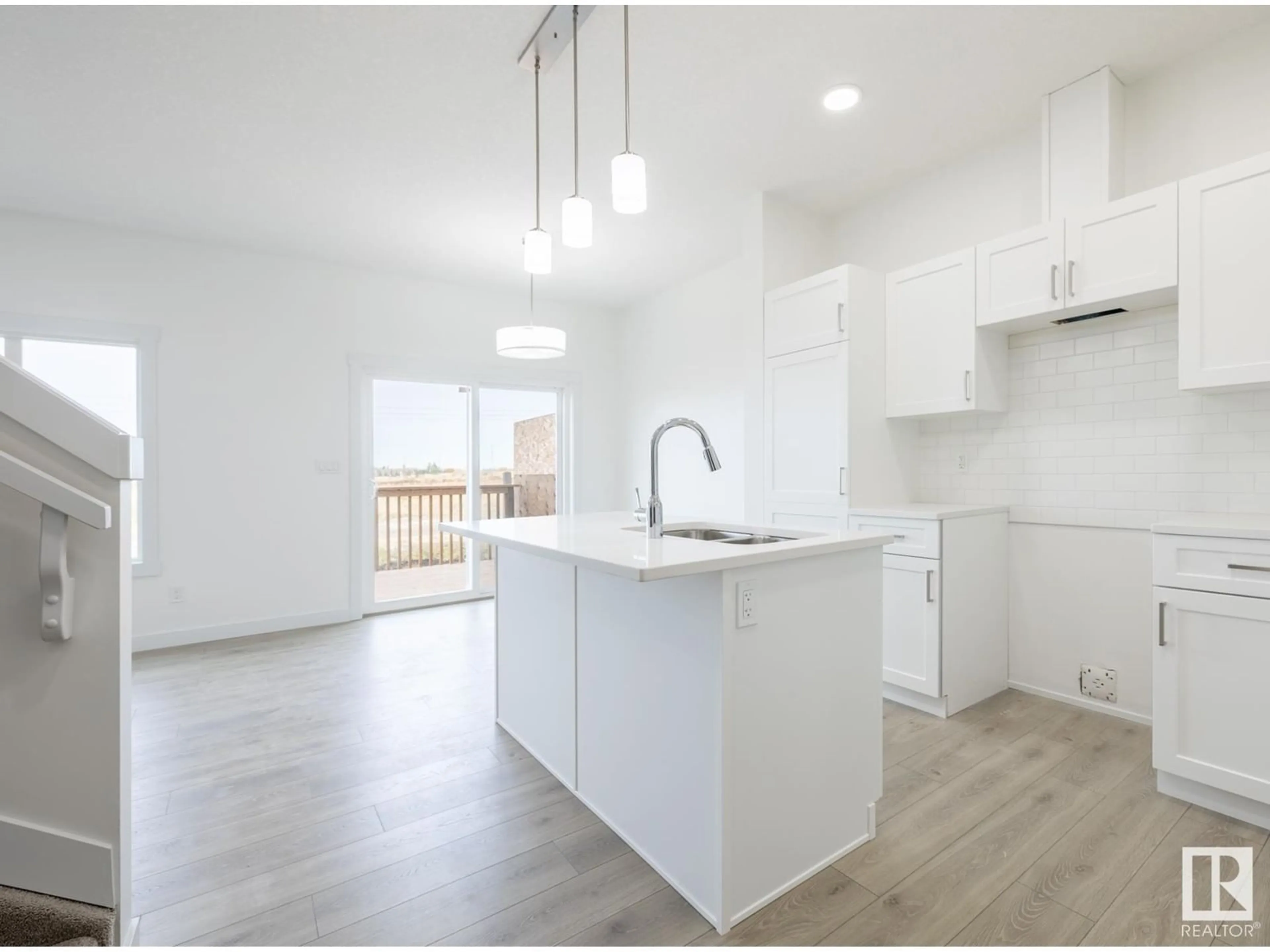 Open concept kitchen, wood/laminate floor for 19130 29 AV, Edmonton Alberta T6M3B5