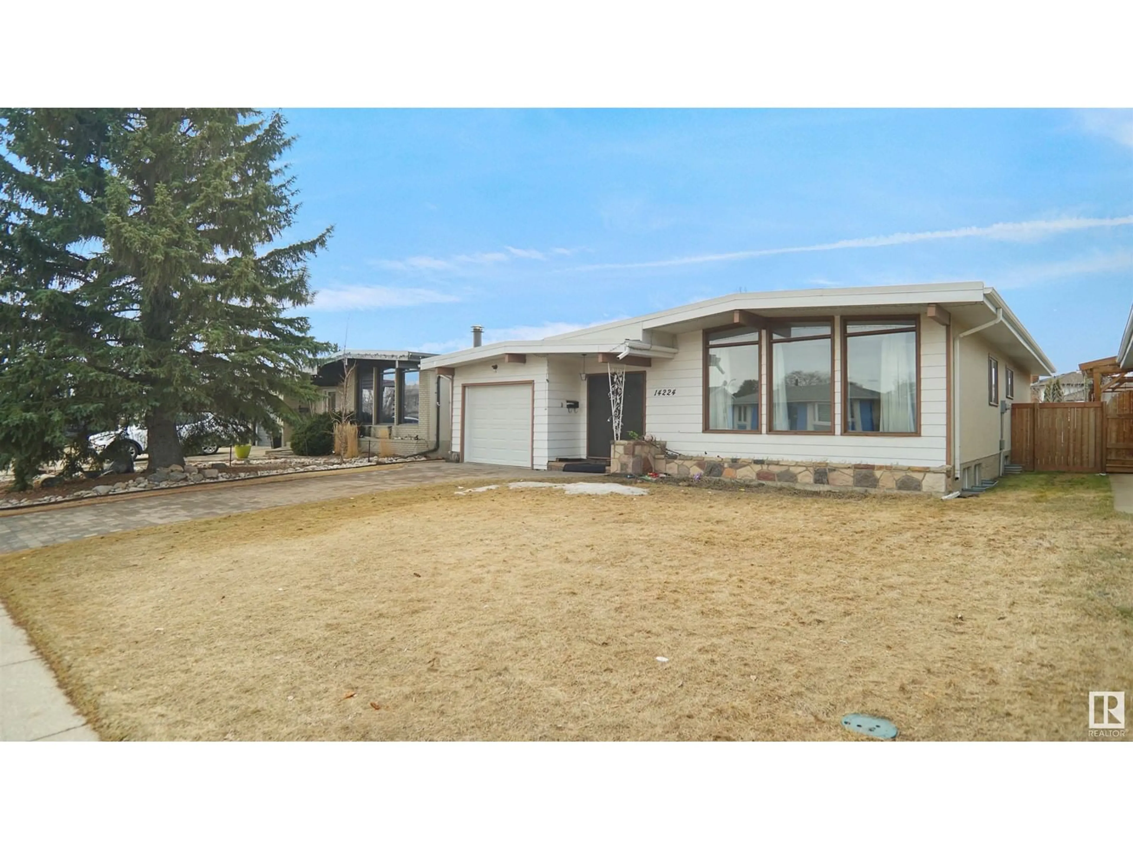 Home with vinyl exterior material, street for 14224 83 ST, Edmonton Alberta T5E2X9