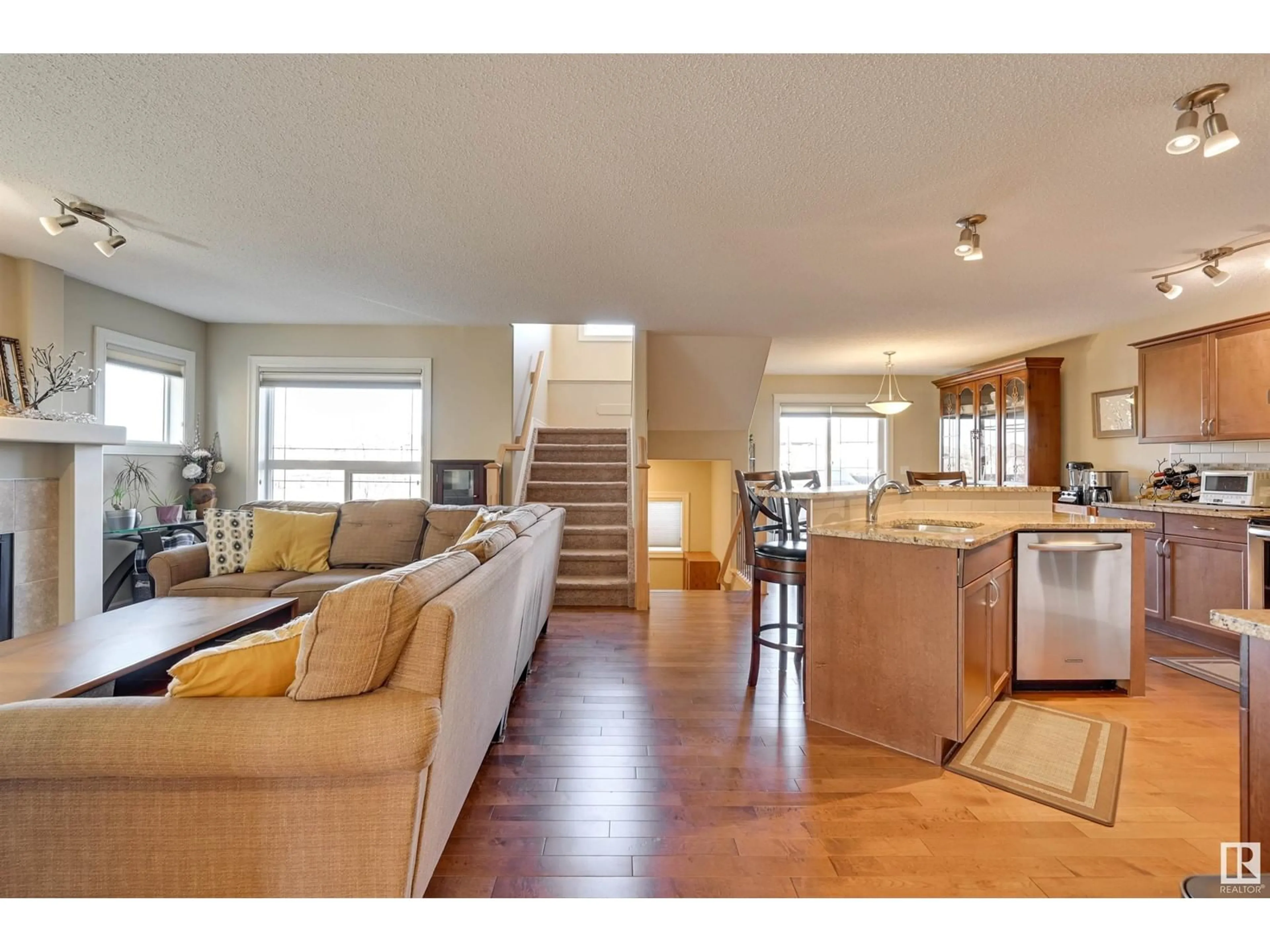 Open concept kitchen, wood/laminate floor for 5742 56A ST, Beaumont Alberta T4X0G1