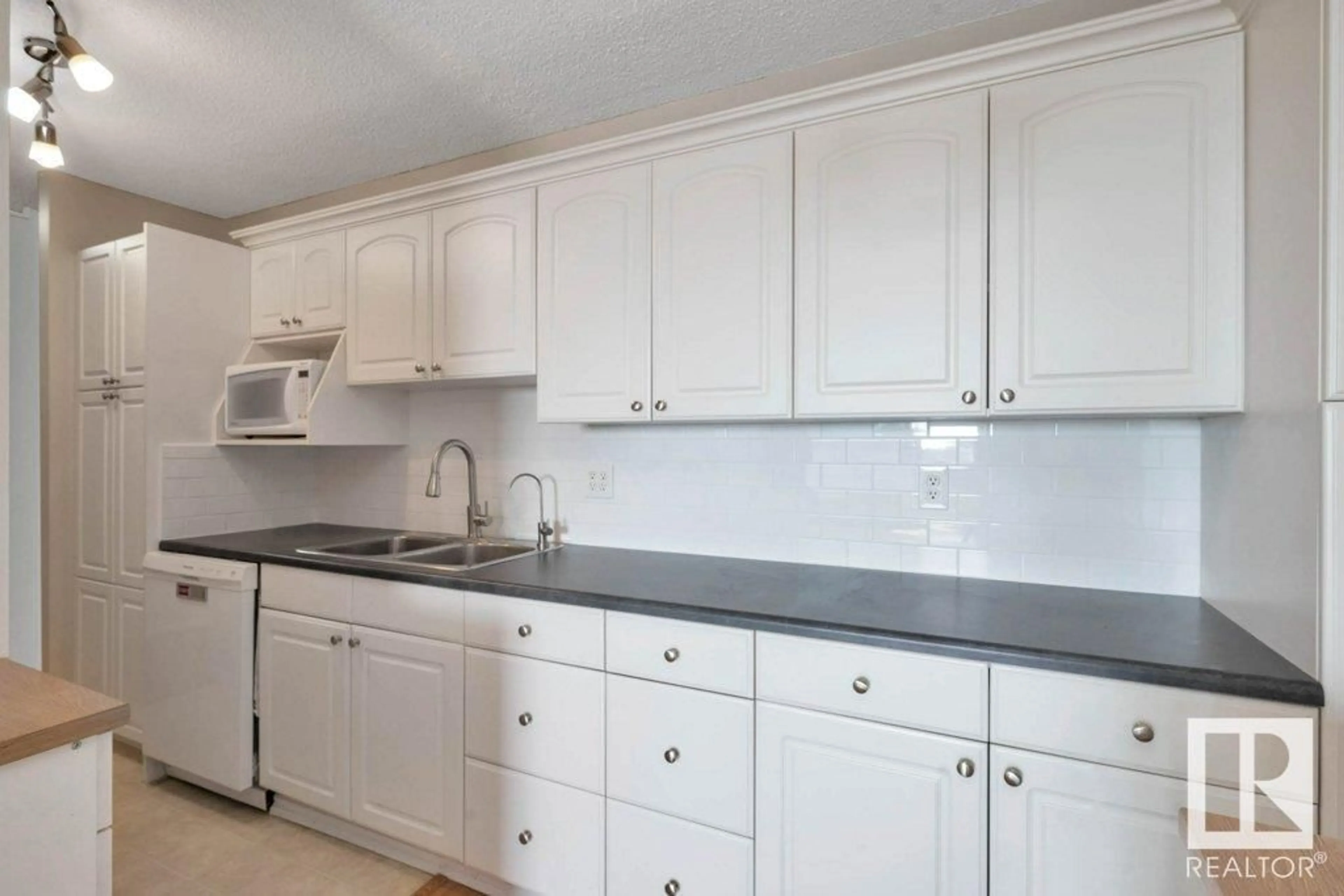 Standard kitchen, ceramic/tile floor for 13910 - 511 STONY PLAIN RD, Edmonton Alberta T5N3R2