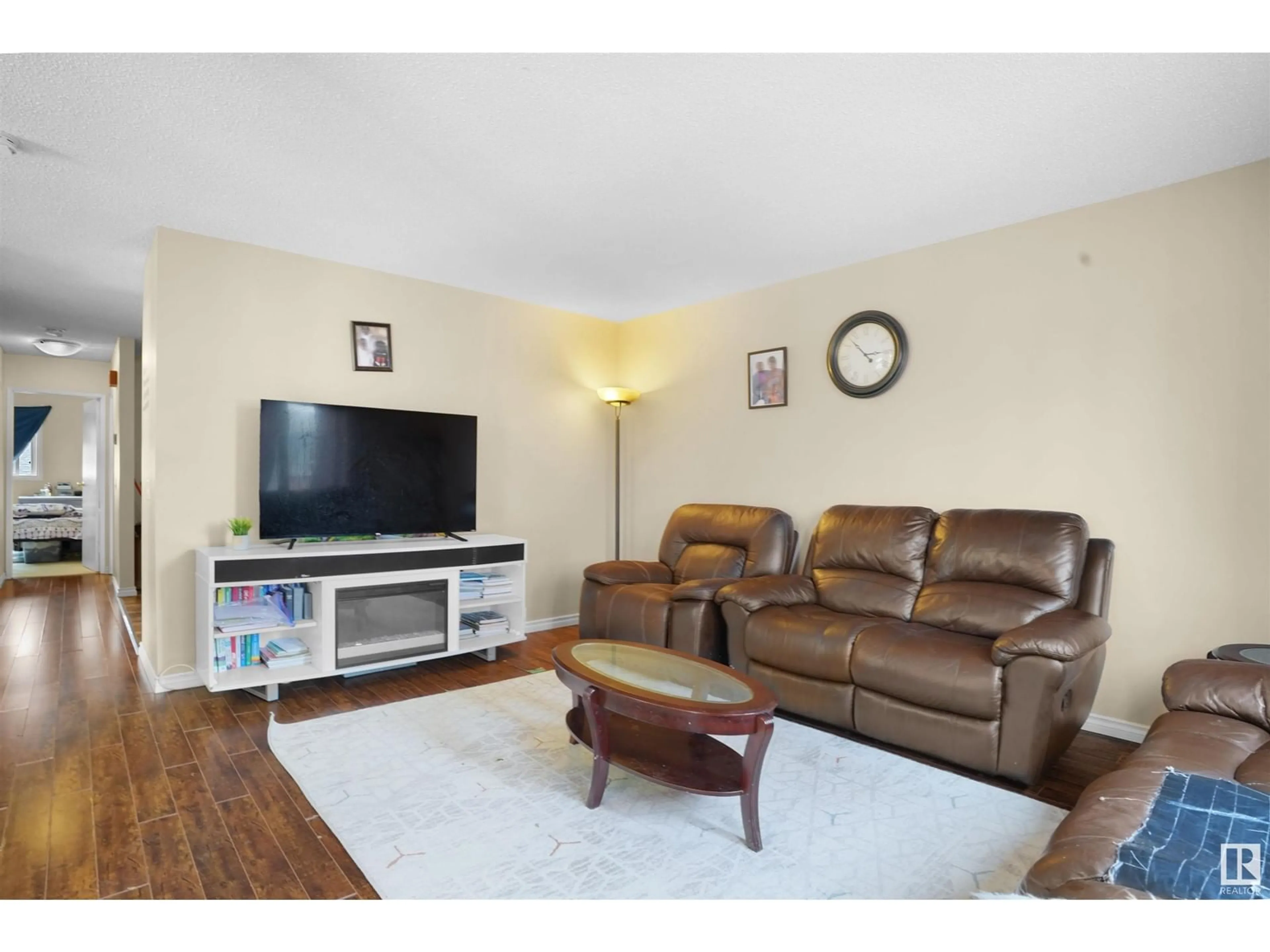 Living room with furniture, wood/laminate floor for NW - 14204 32 ST, Edmonton Alberta T5Y1P1
