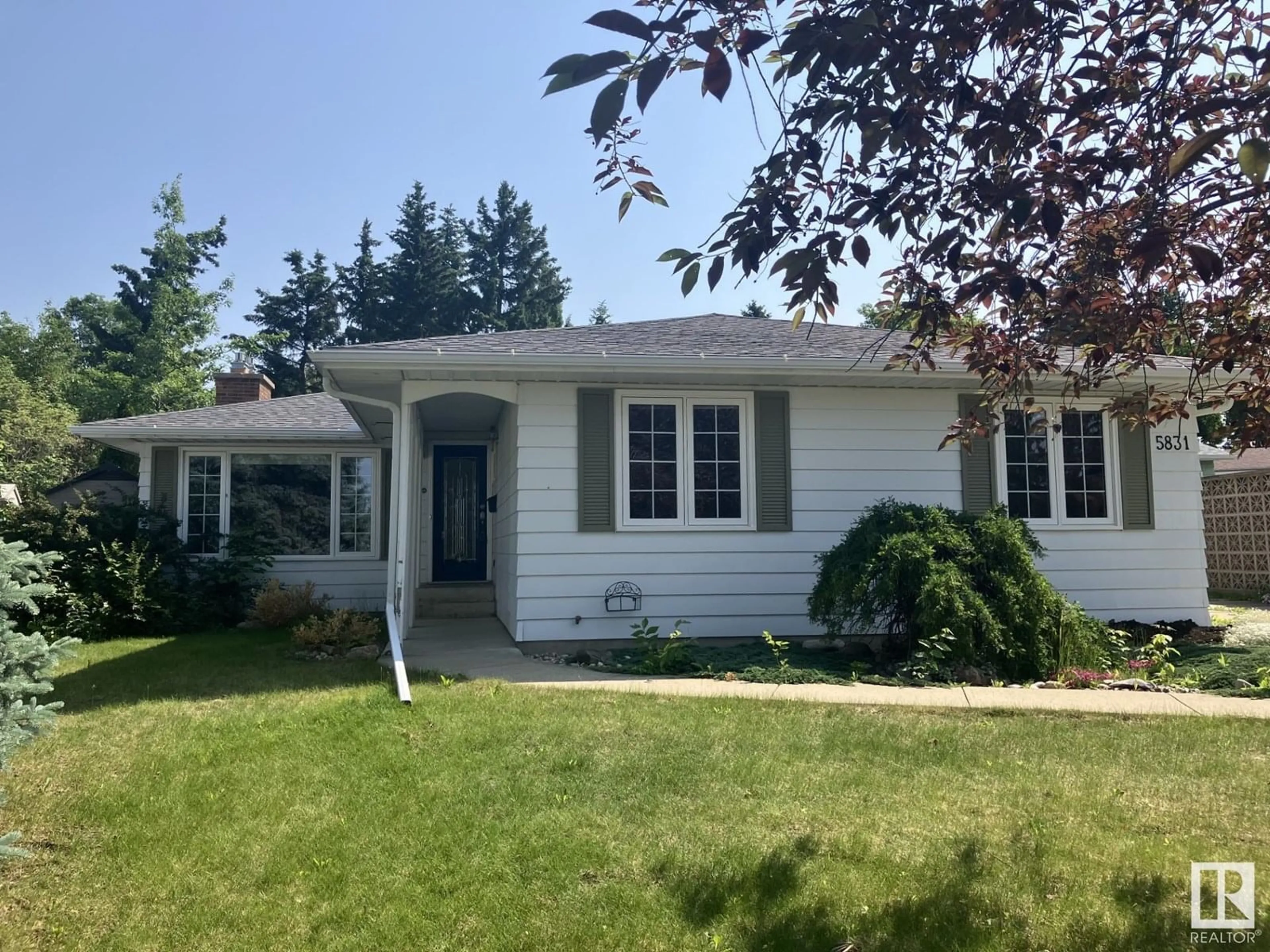 Home with vinyl exterior material, street for 5831 143 A ST NW, Edmonton Alberta T6H4G4