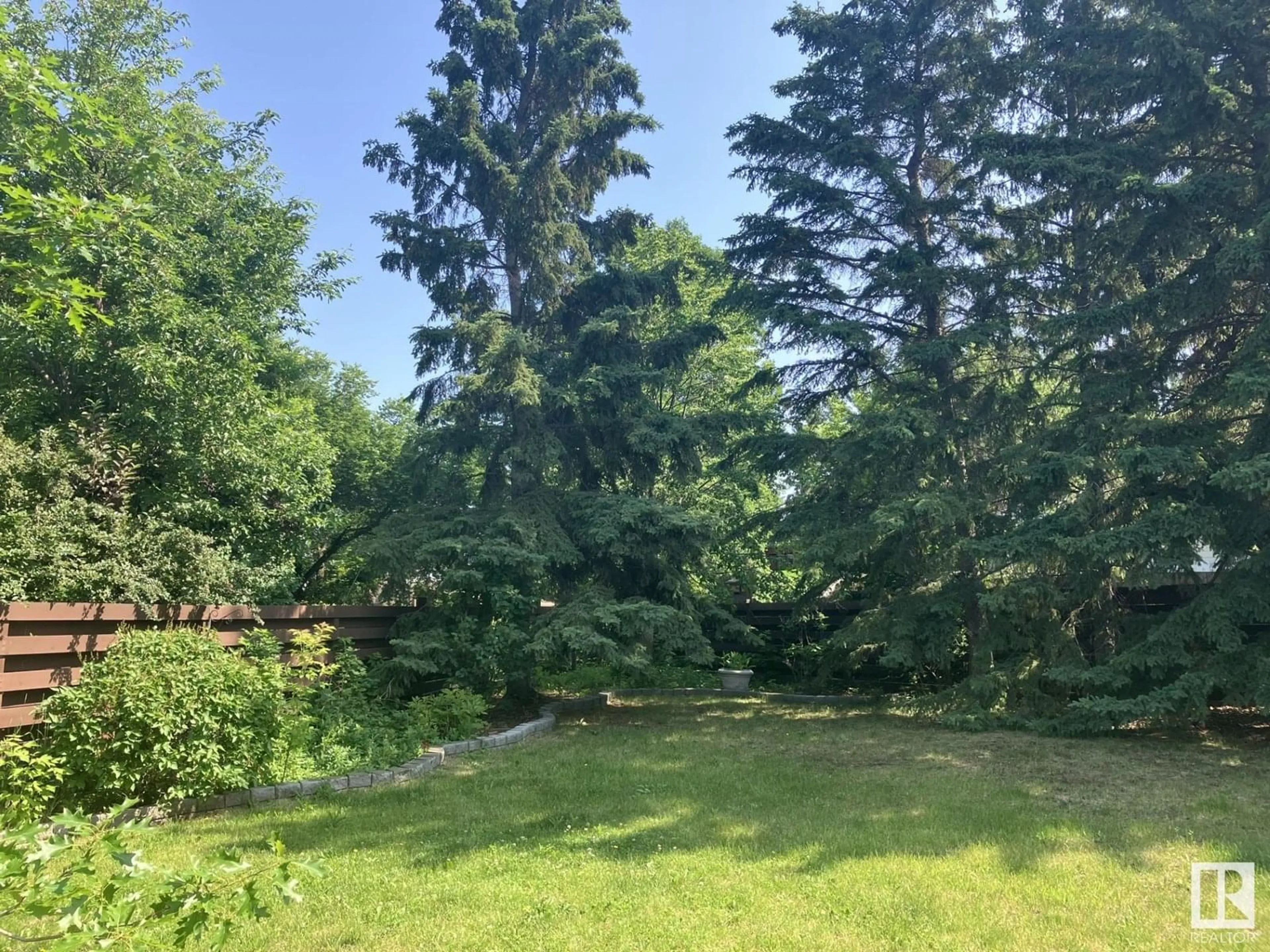 A pic from outside/outdoor area/front of a property/back of a property/a pic from drone, forest/trees view for 5831 143 A ST NW, Edmonton Alberta T6H4G4