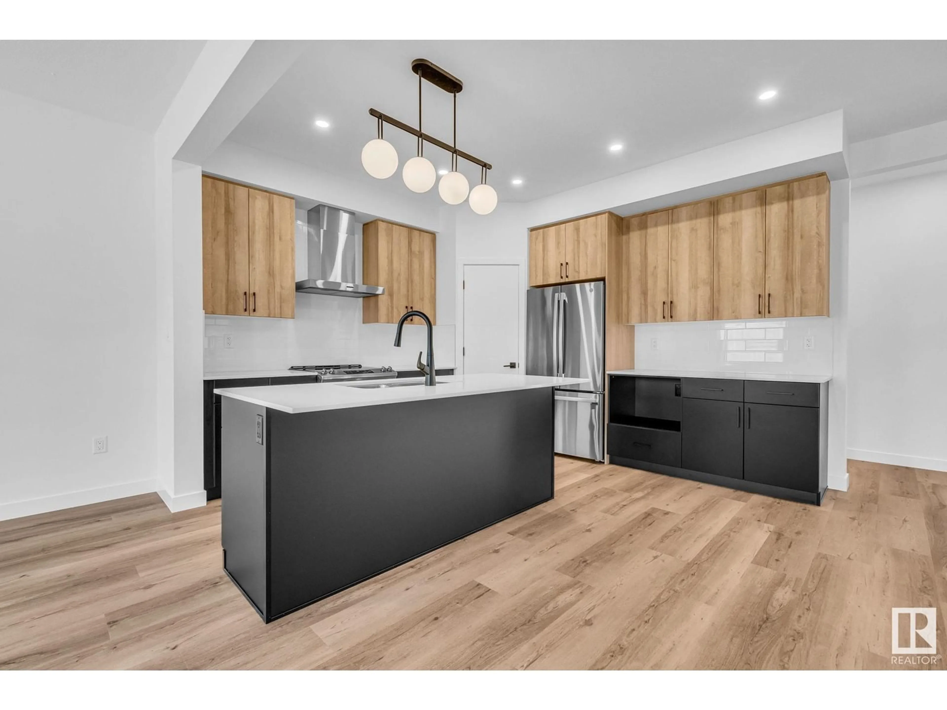 Open concept kitchen, wood/laminate floor for 98 ROYAL ST, St. Albert Alberta T8N7X4