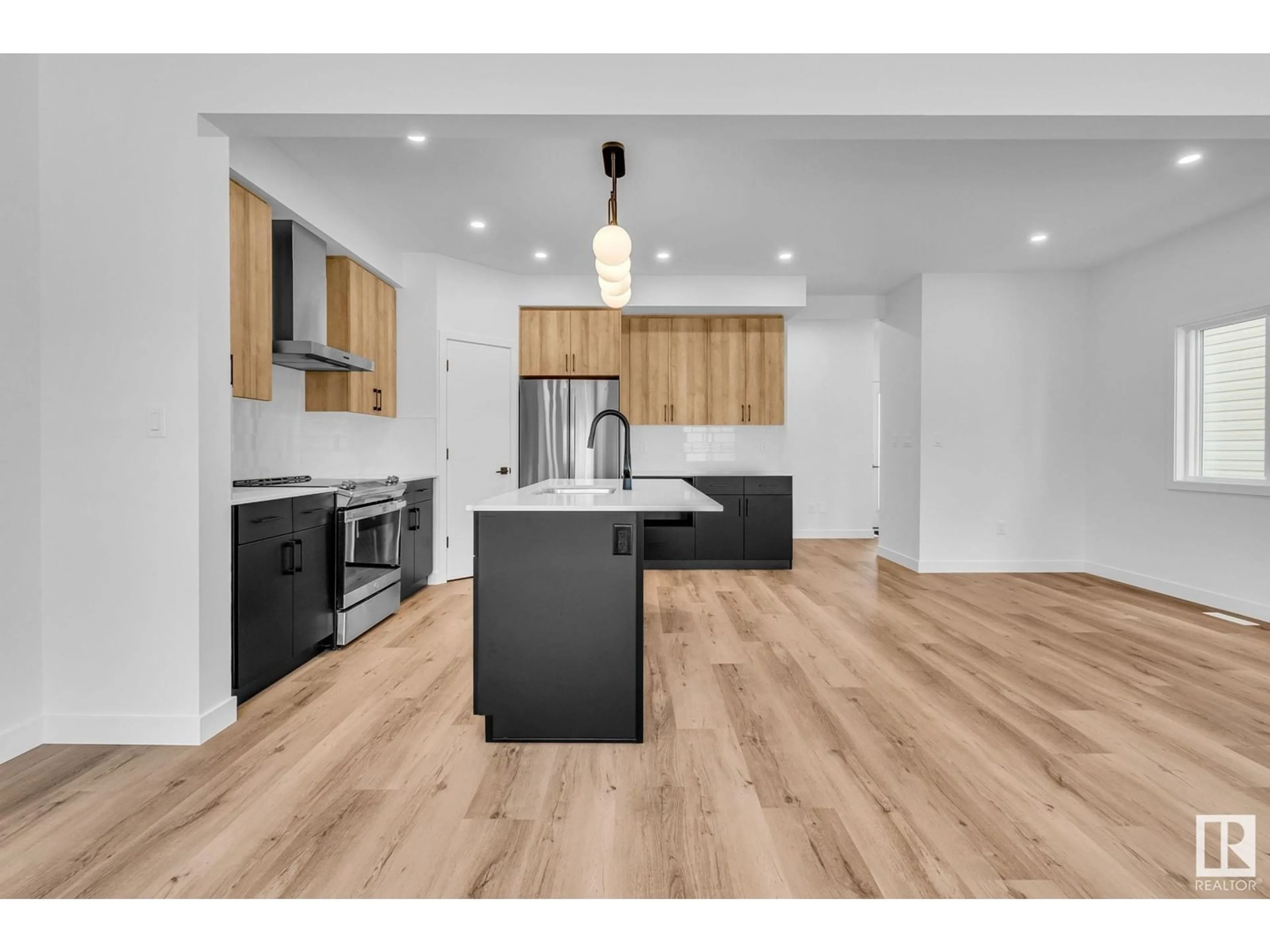 Open concept kitchen, wood/laminate floor for 98 ROYAL ST, St. Albert Alberta T8N7X4