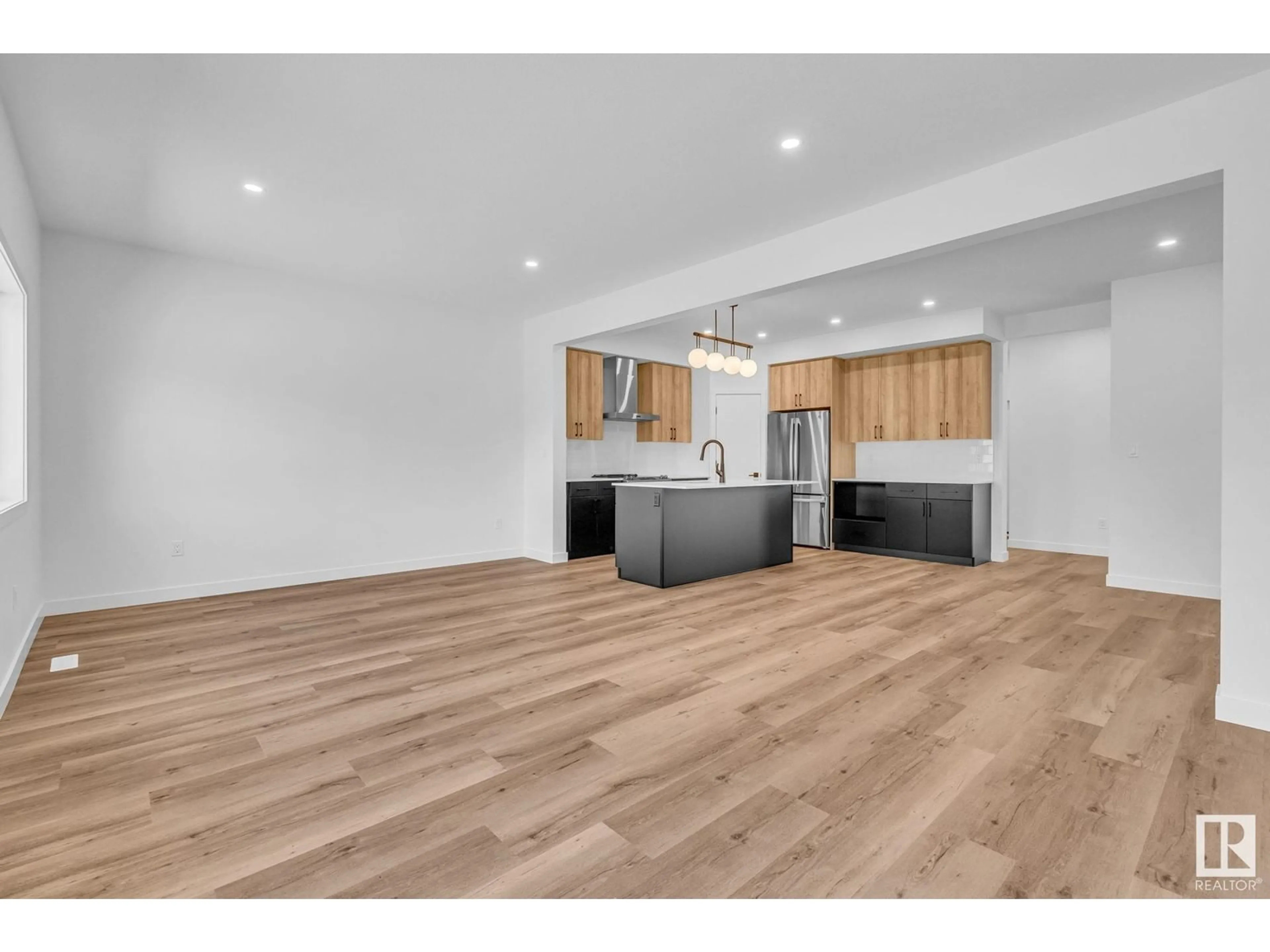 Open concept kitchen, wood/laminate floor for 98 ROYAL ST, St. Albert Alberta T8N7X4