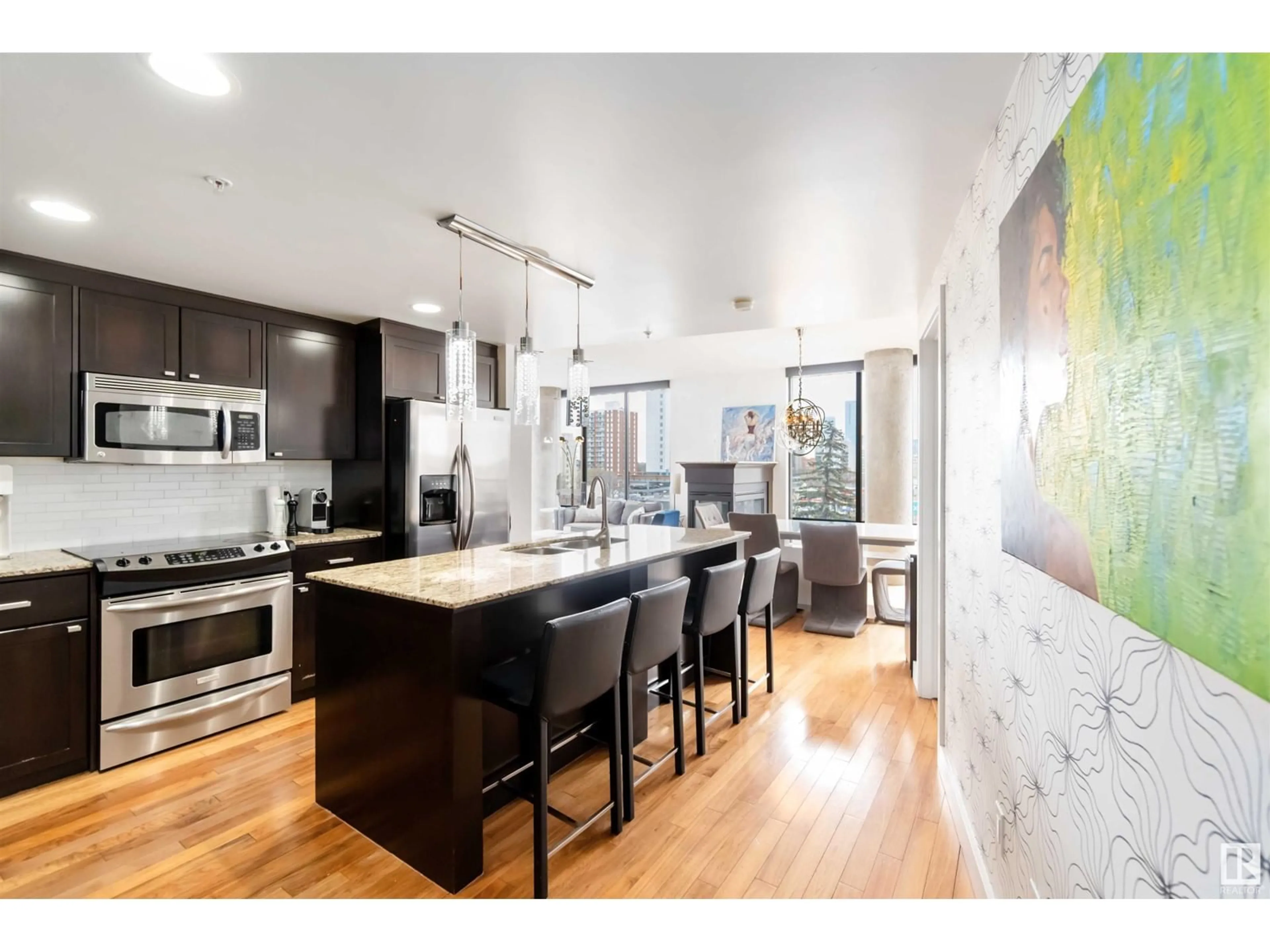 Open concept kitchen, wood/laminate floor for #504 - 10028 119 ST, Edmonton Alberta T5K1Y8