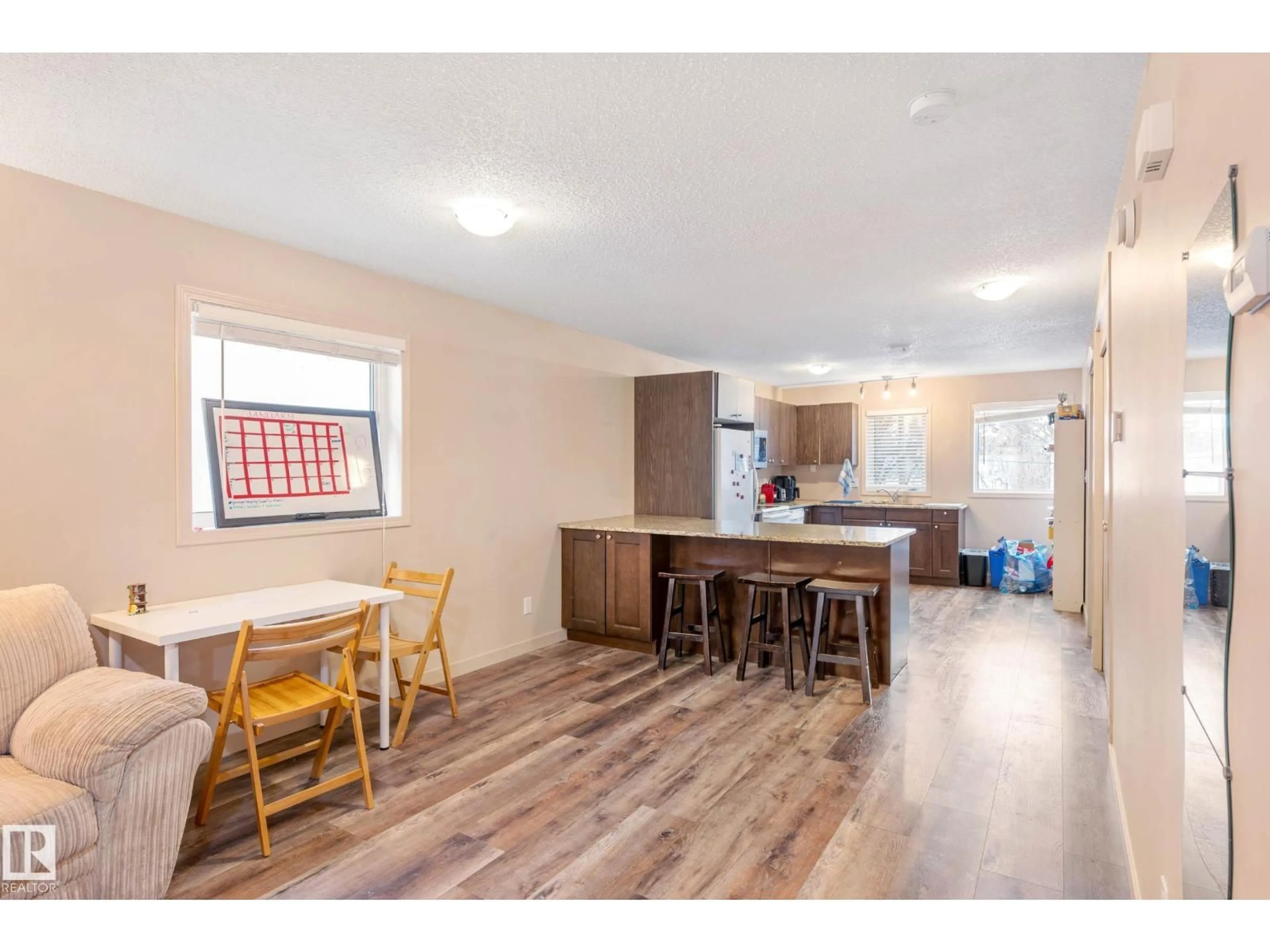 Open concept kitchen, wood/laminate floor for NW - 7712 110 ST, Edmonton Alberta T6G1G1