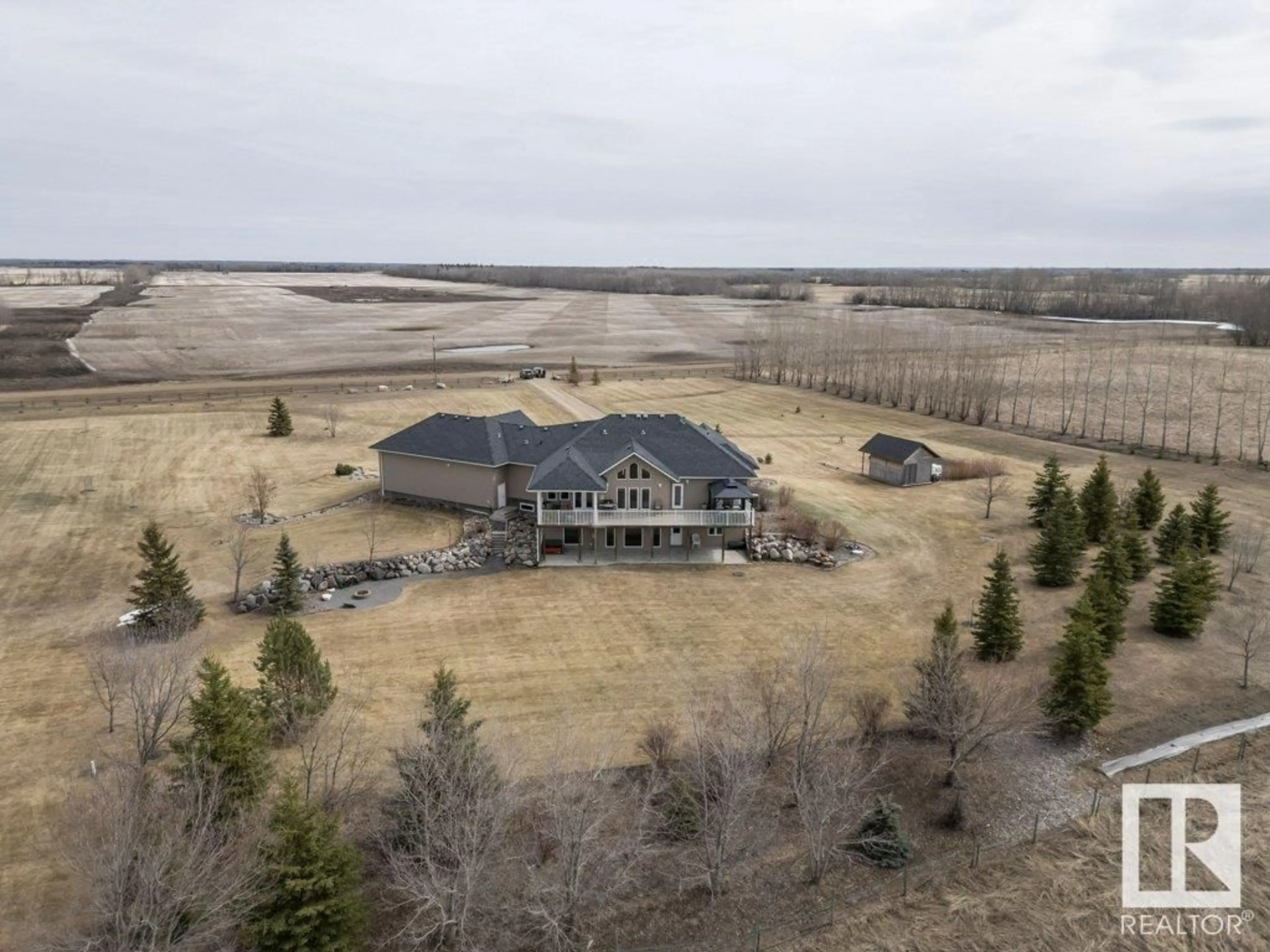 A pic from outside/outdoor area/front of a property/back of a property/a pic from drone, water/lake/river/ocean view for 58032 RR 210, Rural Thorhild County Alberta T0A2W0