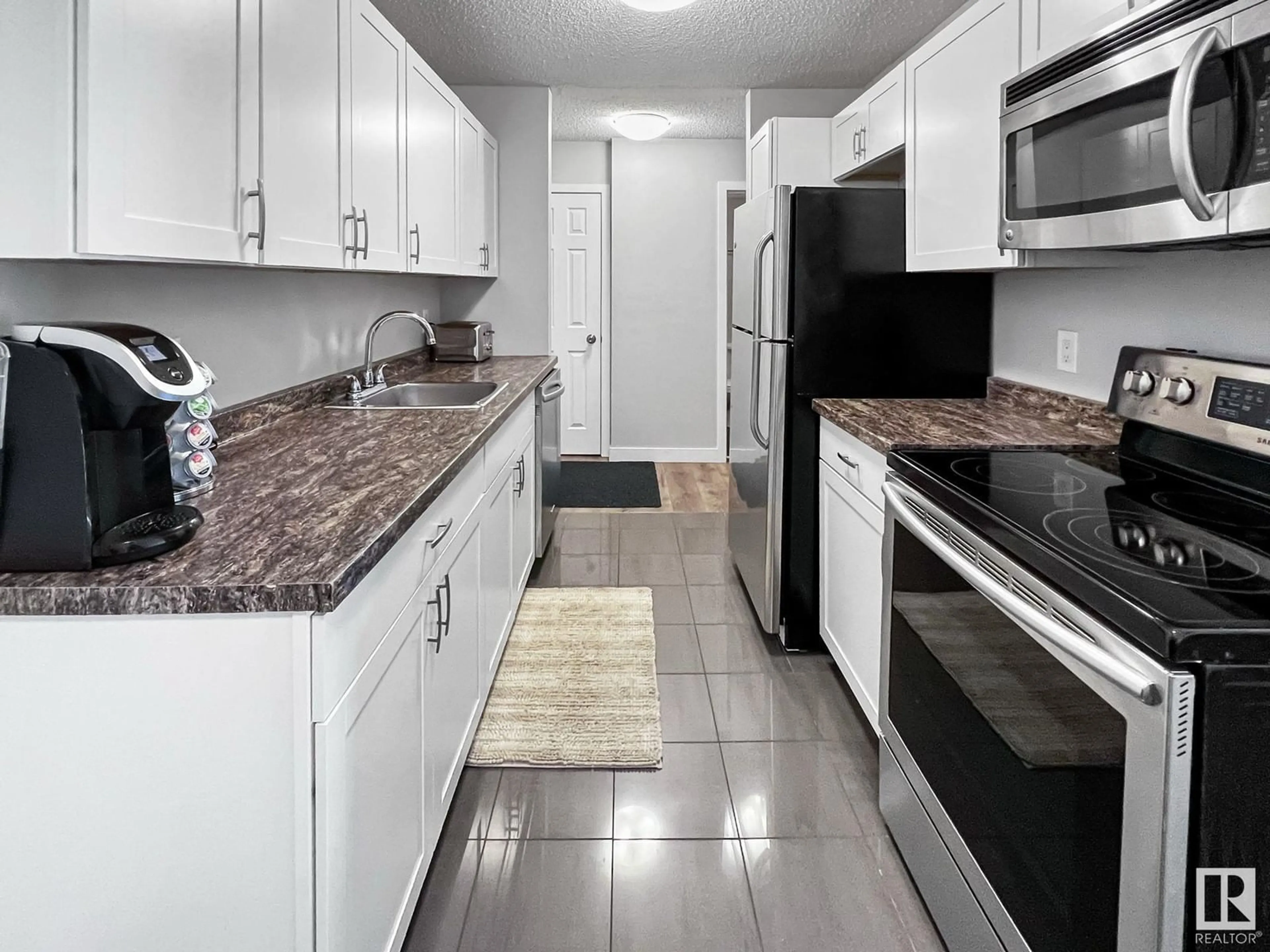 Standard kitchen, ceramic/tile floor for 201 - 10617 107 ST, Edmonton Alberta T5H2Y8