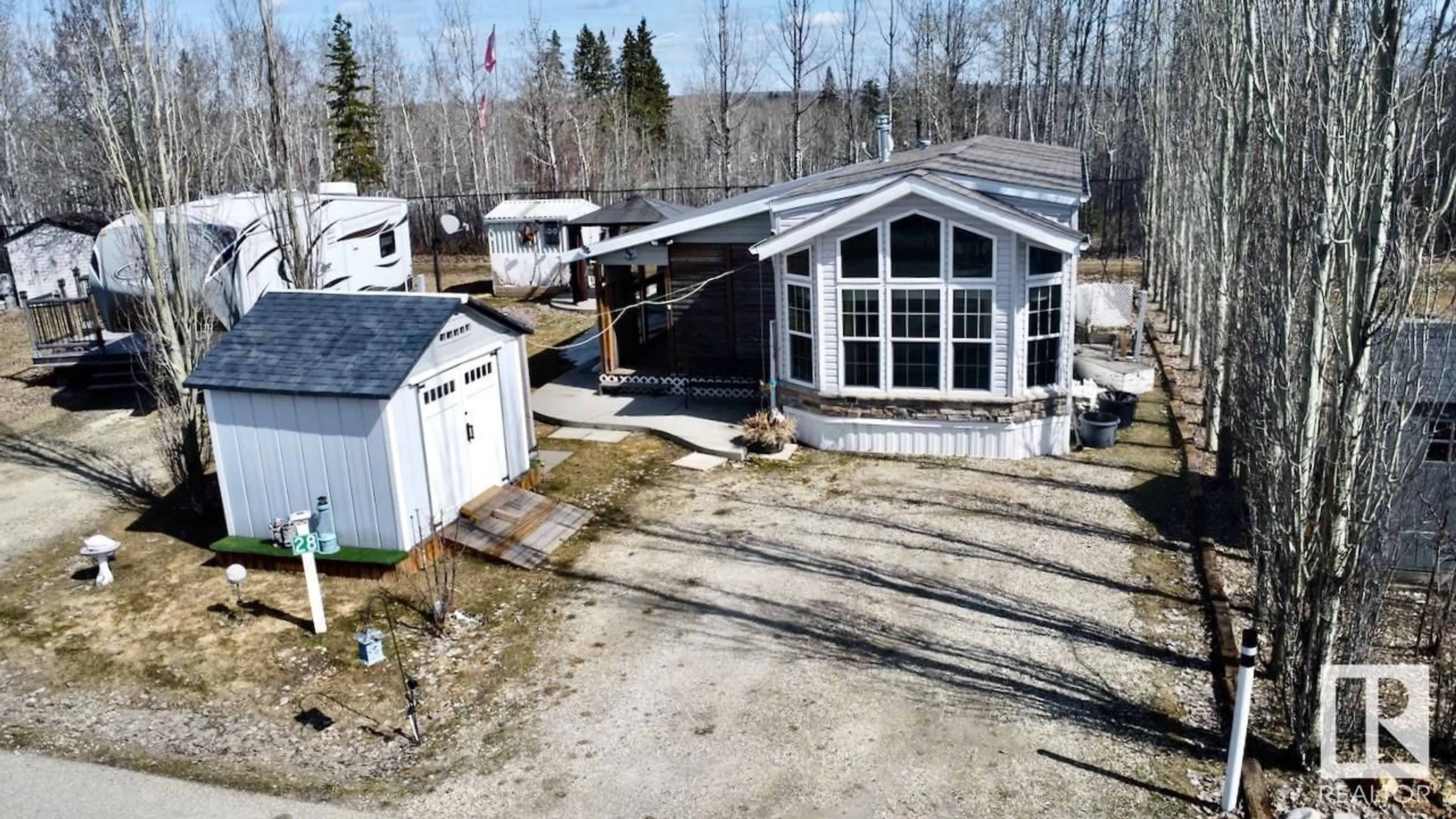 A pic from outside/outdoor area/front of a property/back of a property/a pic from drone, unknown for 53207 - 28 HGHWAY 31, Rural Parkland County Alberta T0E2B0