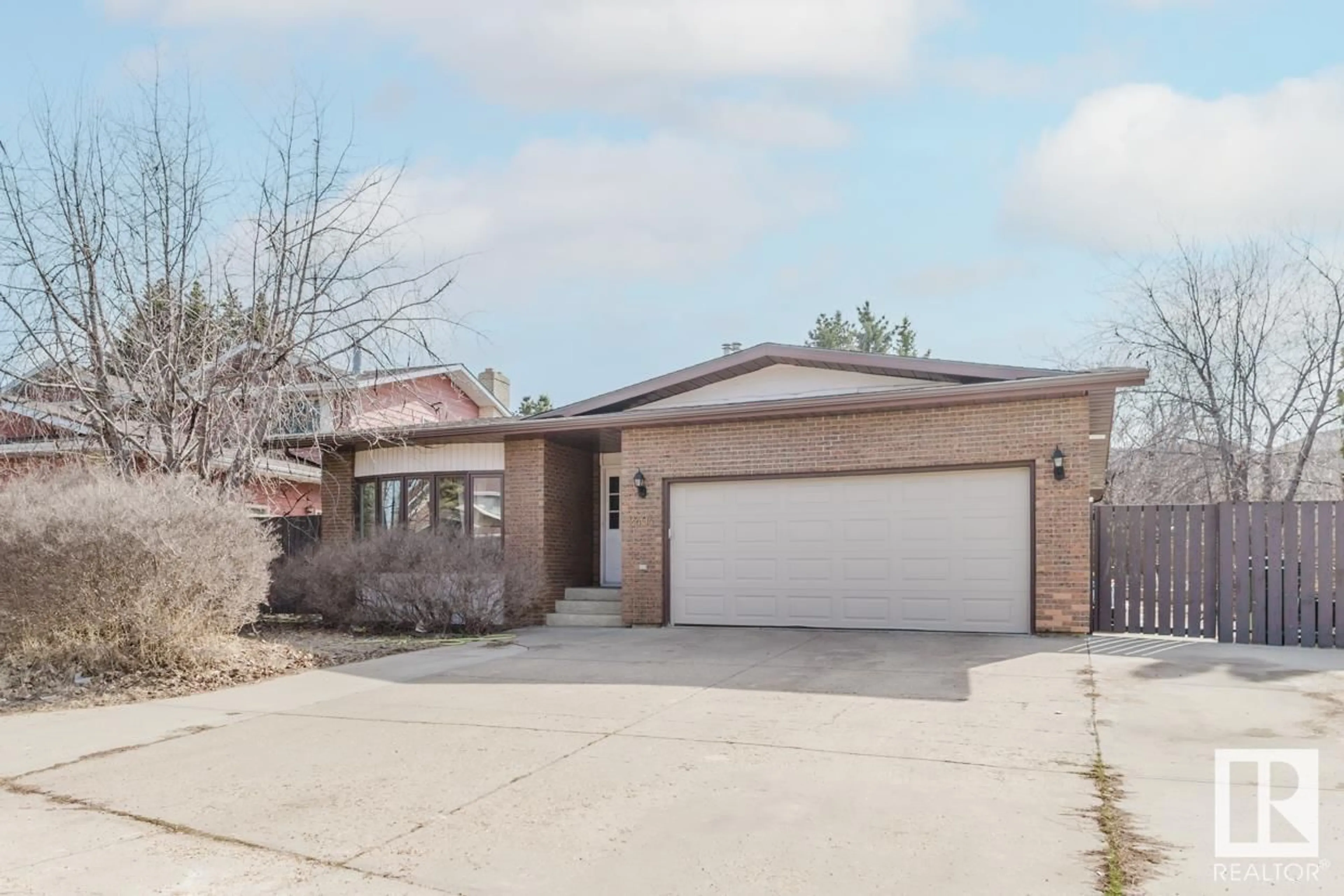 Home with brick exterior material, street for 2404 113 ST, Edmonton Alberta T6J4Y5