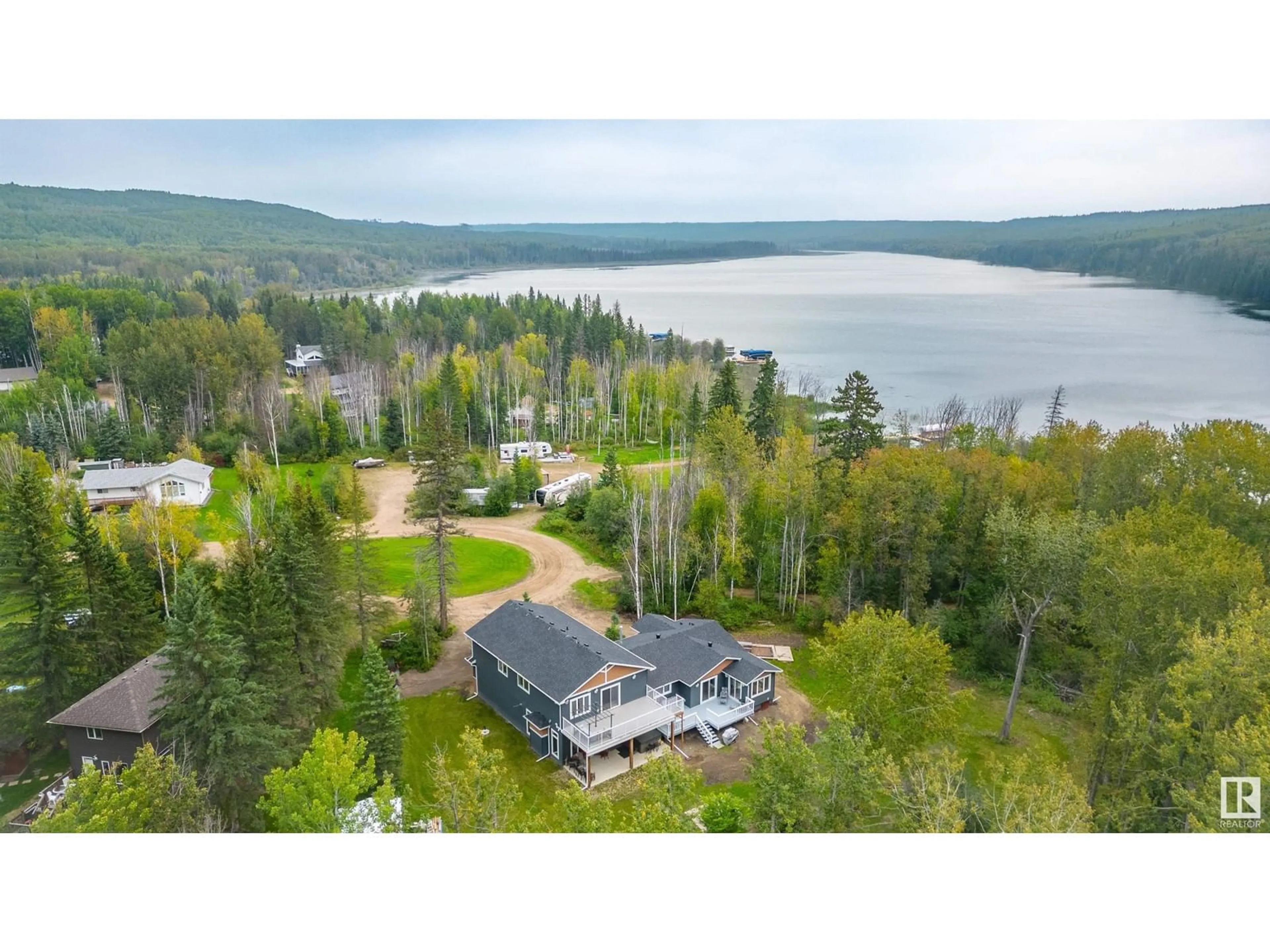 A pic from outside/outdoor area/front of a property/back of a property/a pic from drone, water/lake/river/ocean view for 1205 LONG LAKE DR, Long Lake Alberta T0A0M0