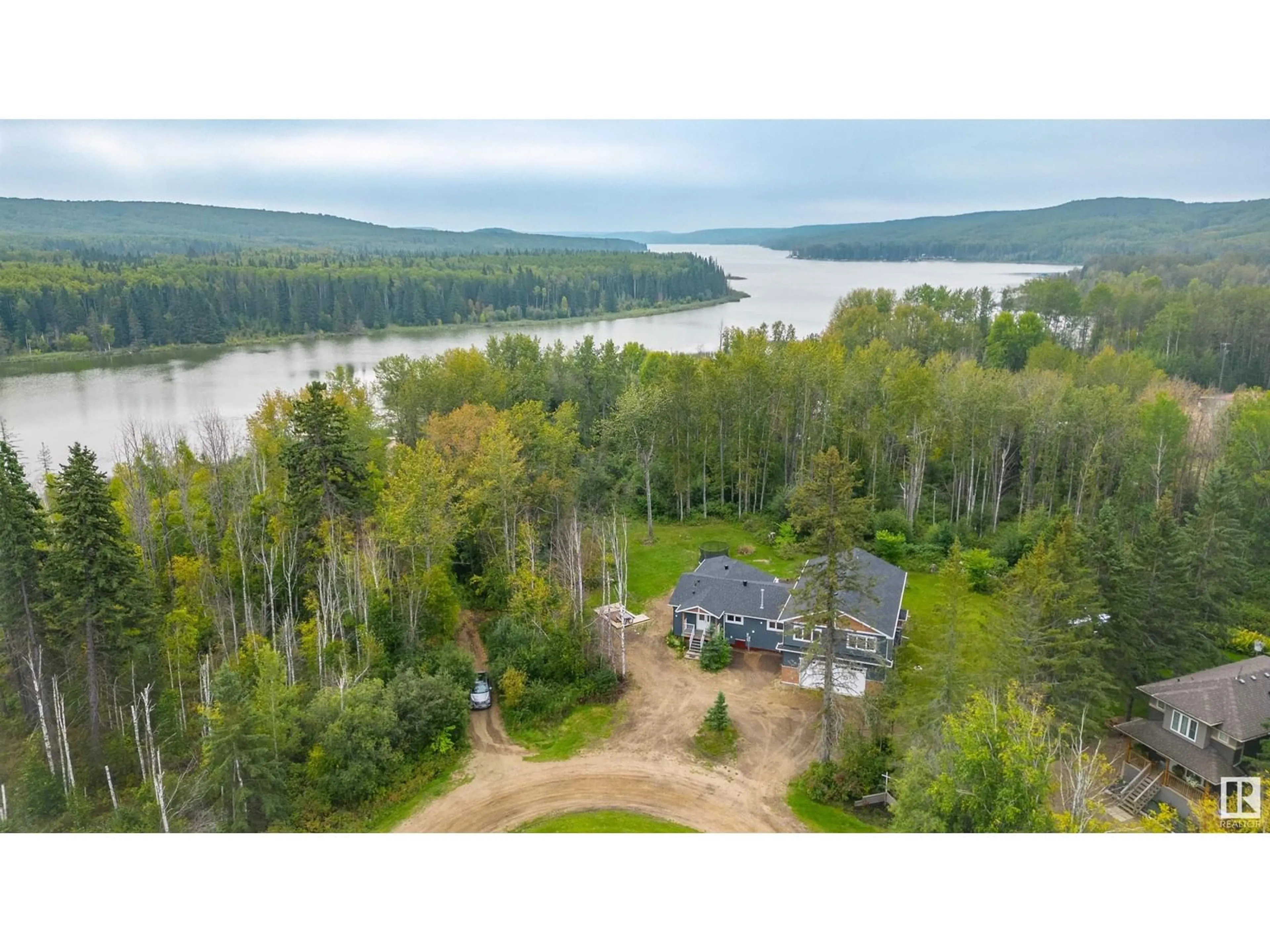 A pic from outside/outdoor area/front of a property/back of a property/a pic from drone, water/lake/river/ocean view for 1205 LONG LAKE DR, Long Lake Alberta T0A0M0