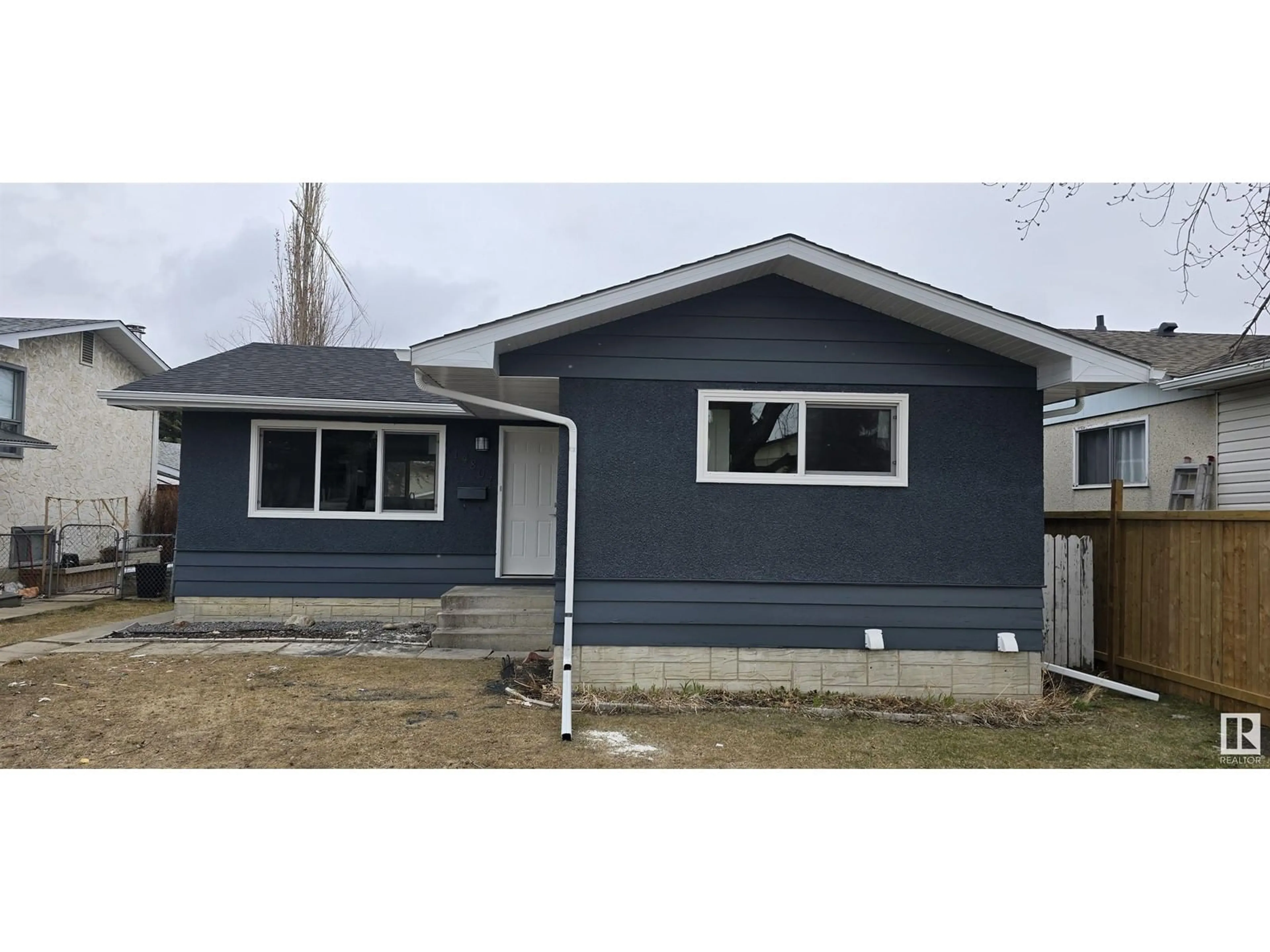 Home with vinyl exterior material, street for 14807 95A ST NW, Edmonton Alberta T5E4A5