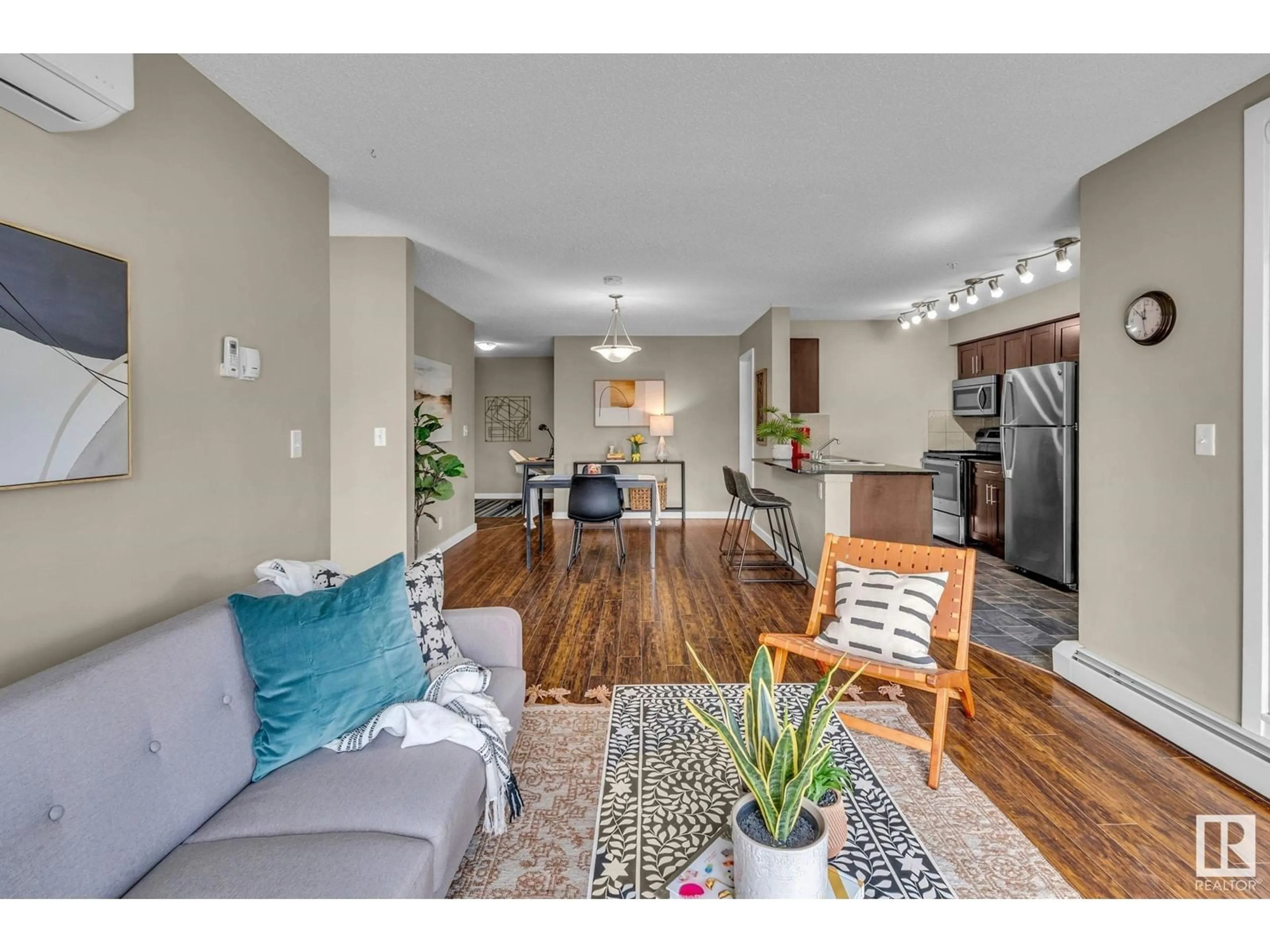 Living room with furniture, wood/laminate floor for 5816 - 125 MULLEN PL, Edmonton Alberta T6R0W3