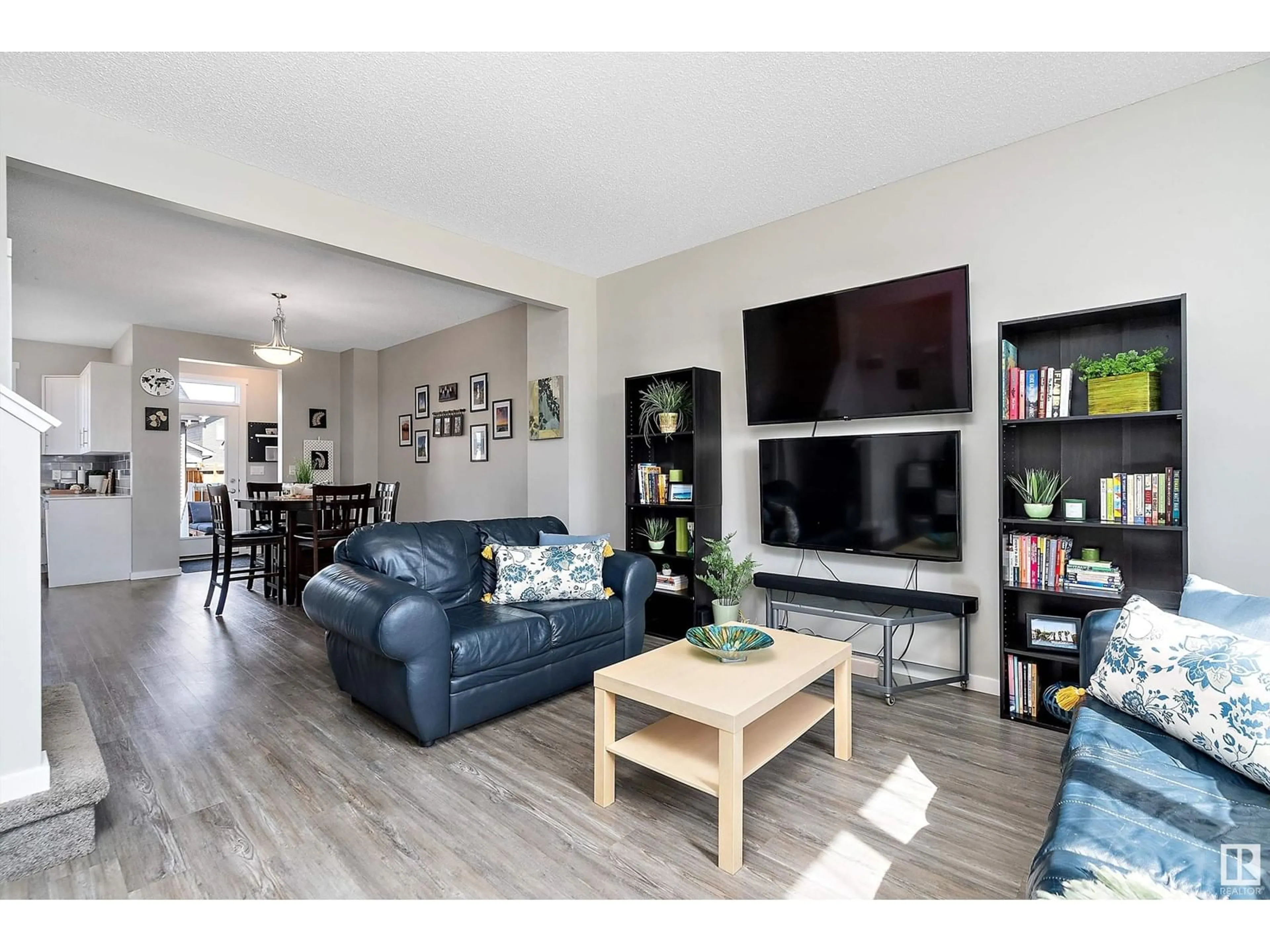 Living room with furniture, wood/laminate floor for 2284 GLENRIDDING BV, Edmonton Alberta T6W3P5