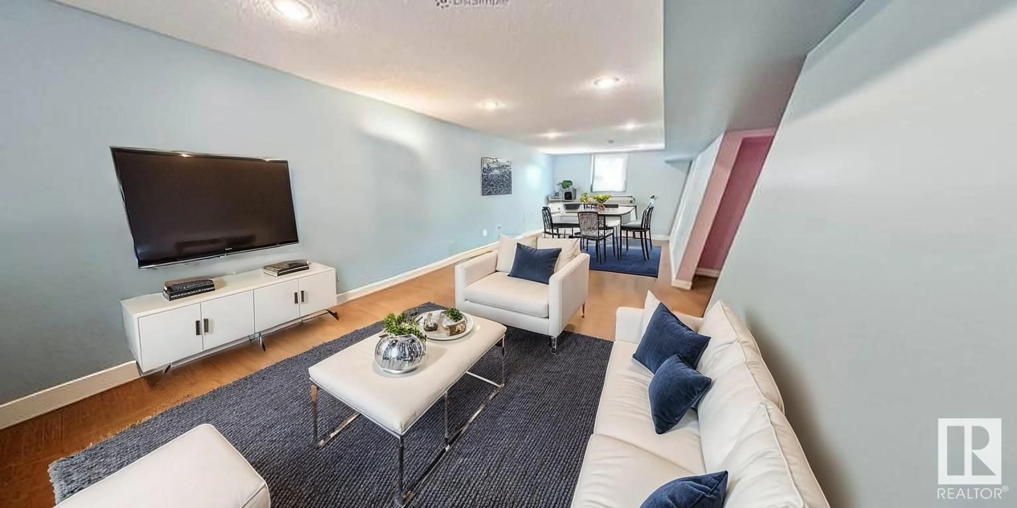 Living room with furniture, wood/laminate floor for NW - 10816 139 ST, Edmonton Alberta T5M1P7