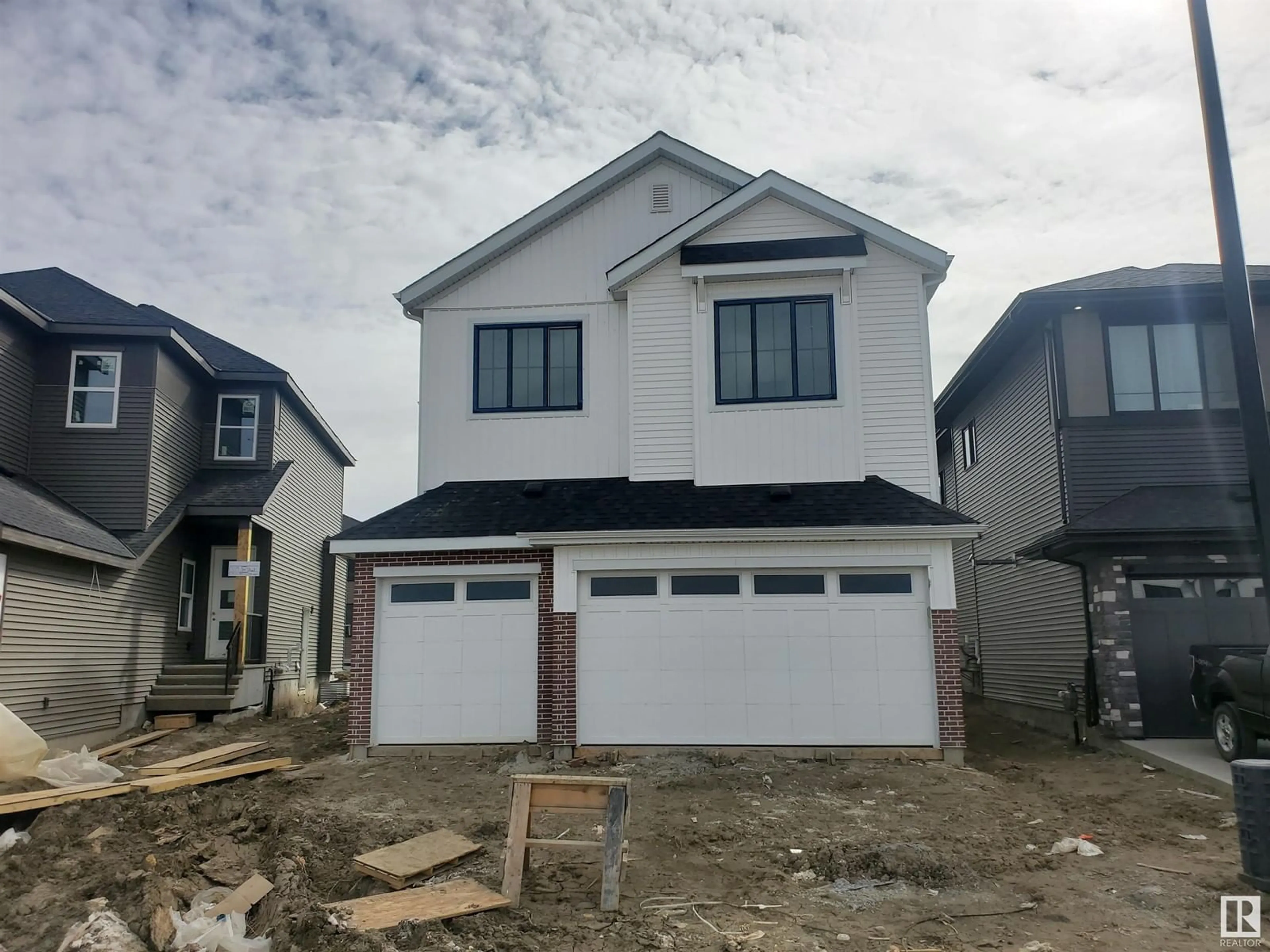 Home with vinyl exterior material, street for 17115 3 ST, Edmonton Alberta T5Y4G8