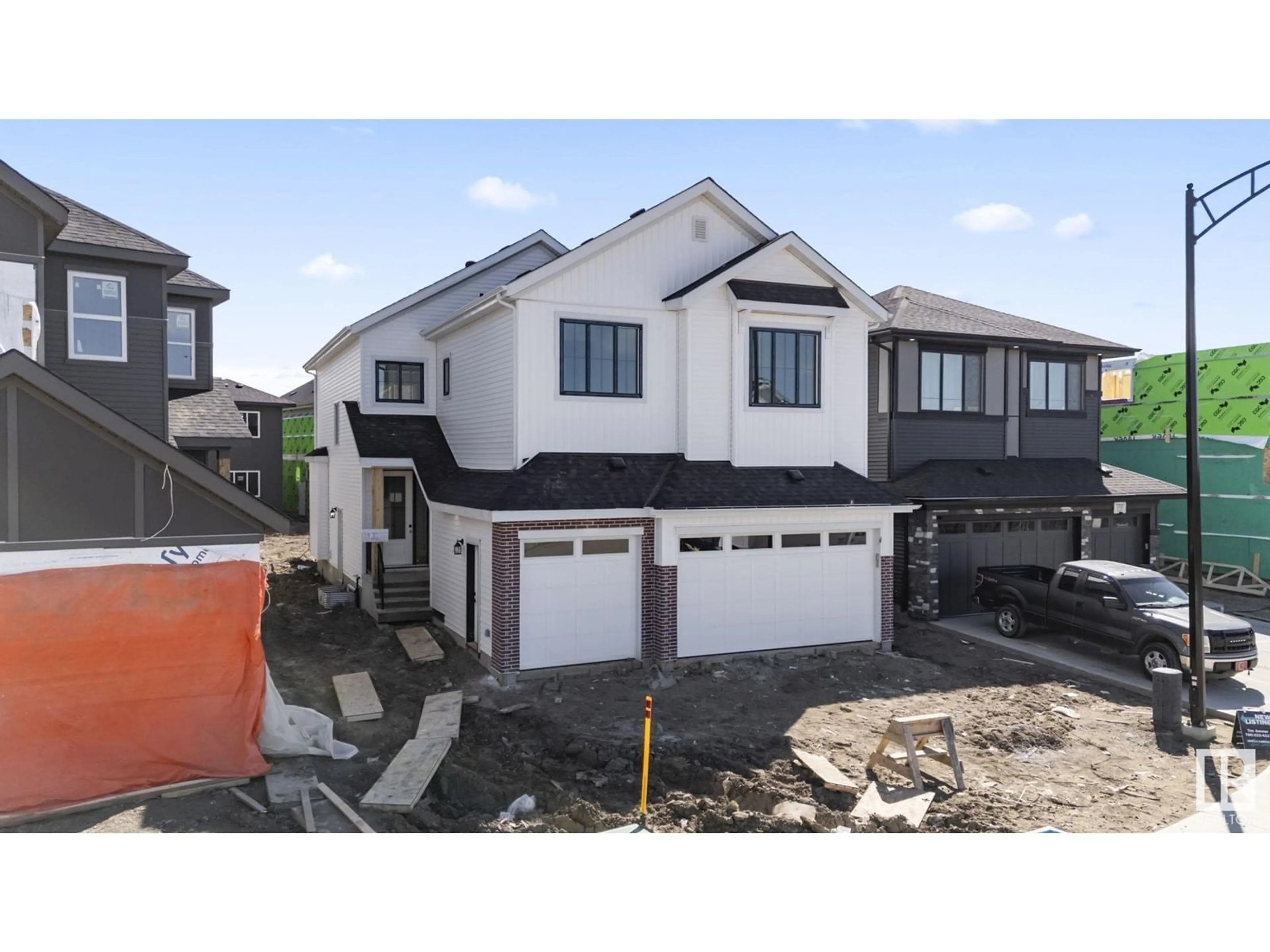 Home with vinyl exterior material, street for 17115 3 ST, Edmonton Alberta T5Y4G8