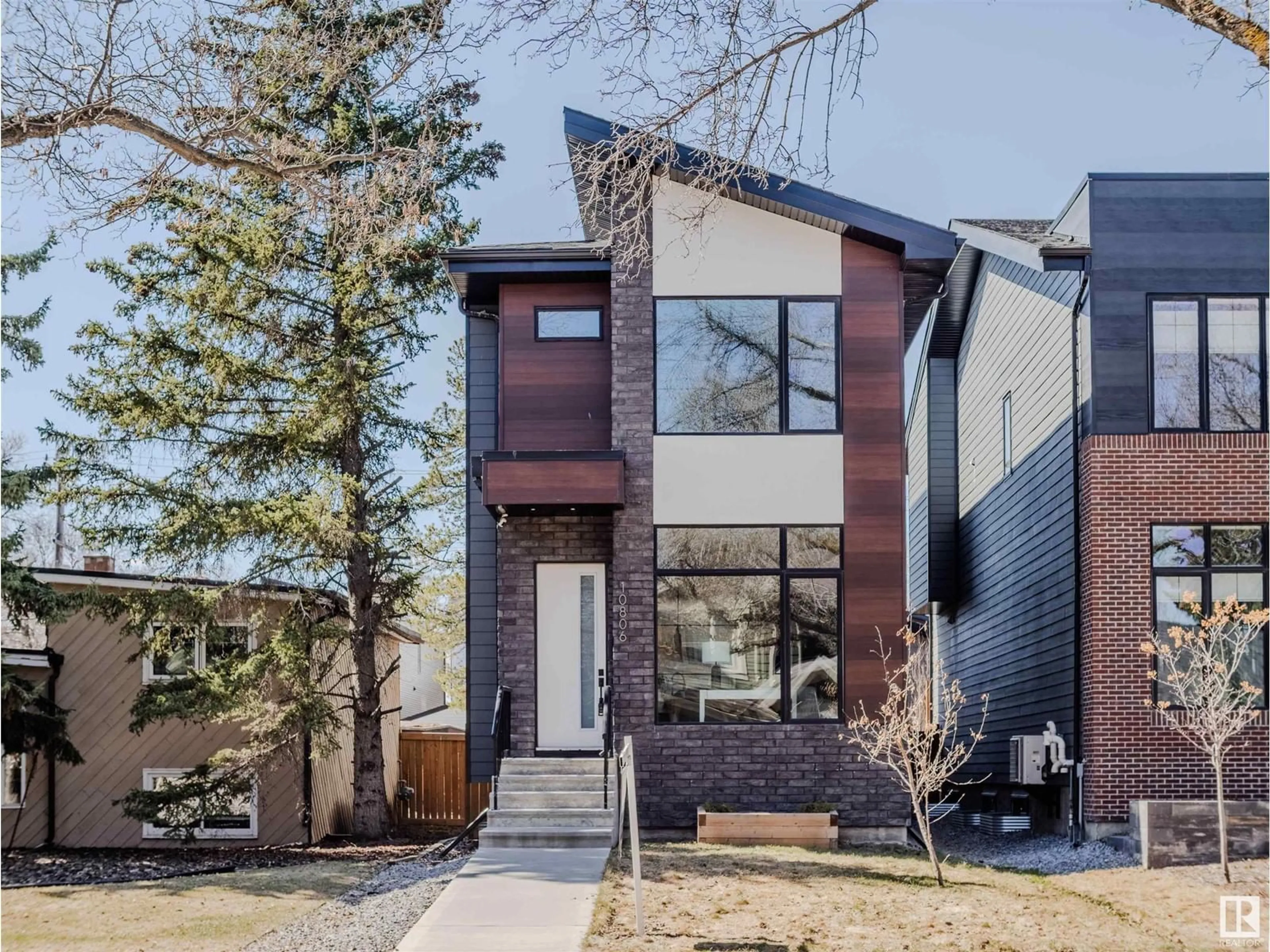 Home with brick exterior material, street for NW - 10806 129 ST, Edmonton Alberta T5M0X8
