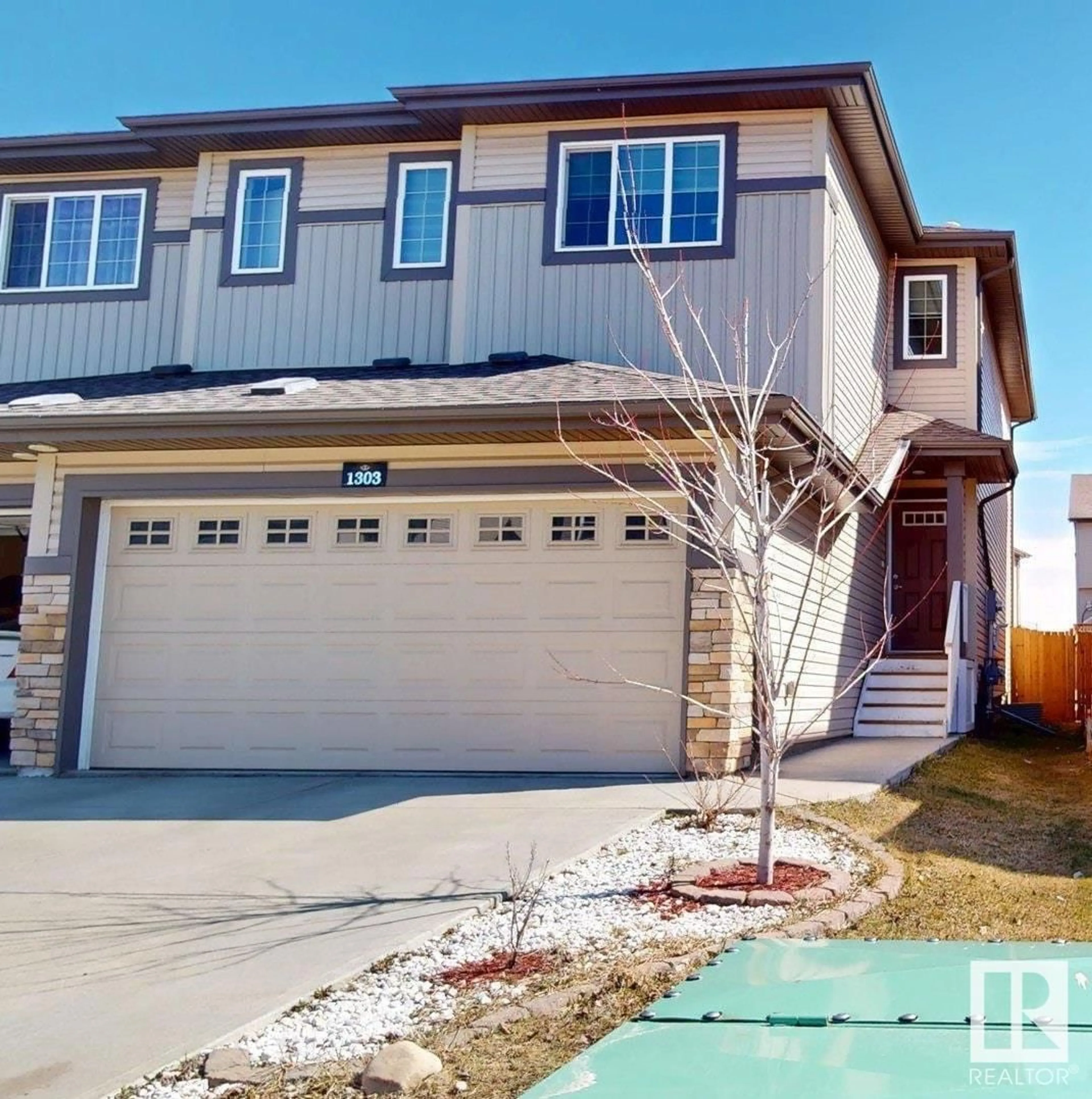 Home with vinyl exterior material, street for 1303 27 ST, Edmonton Alberta T6T0K1