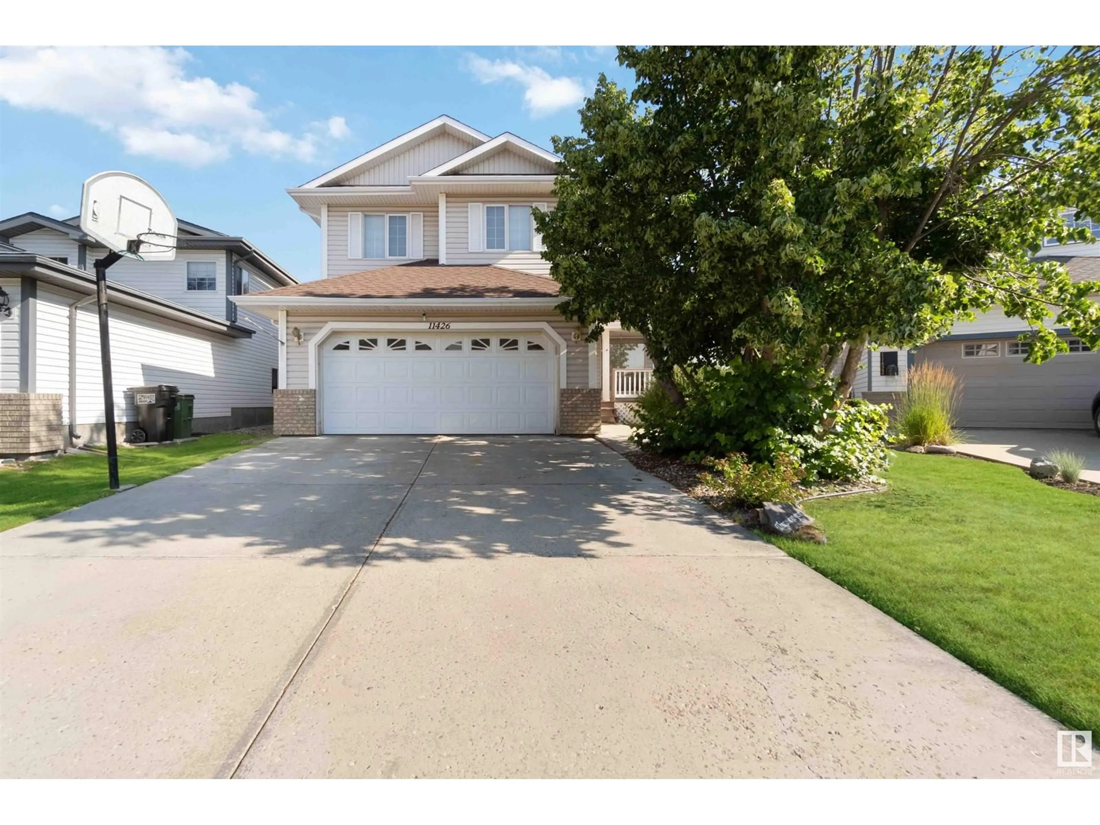 Home with vinyl exterior material, street for 11426 9A AV, Edmonton Alberta T6J7B2