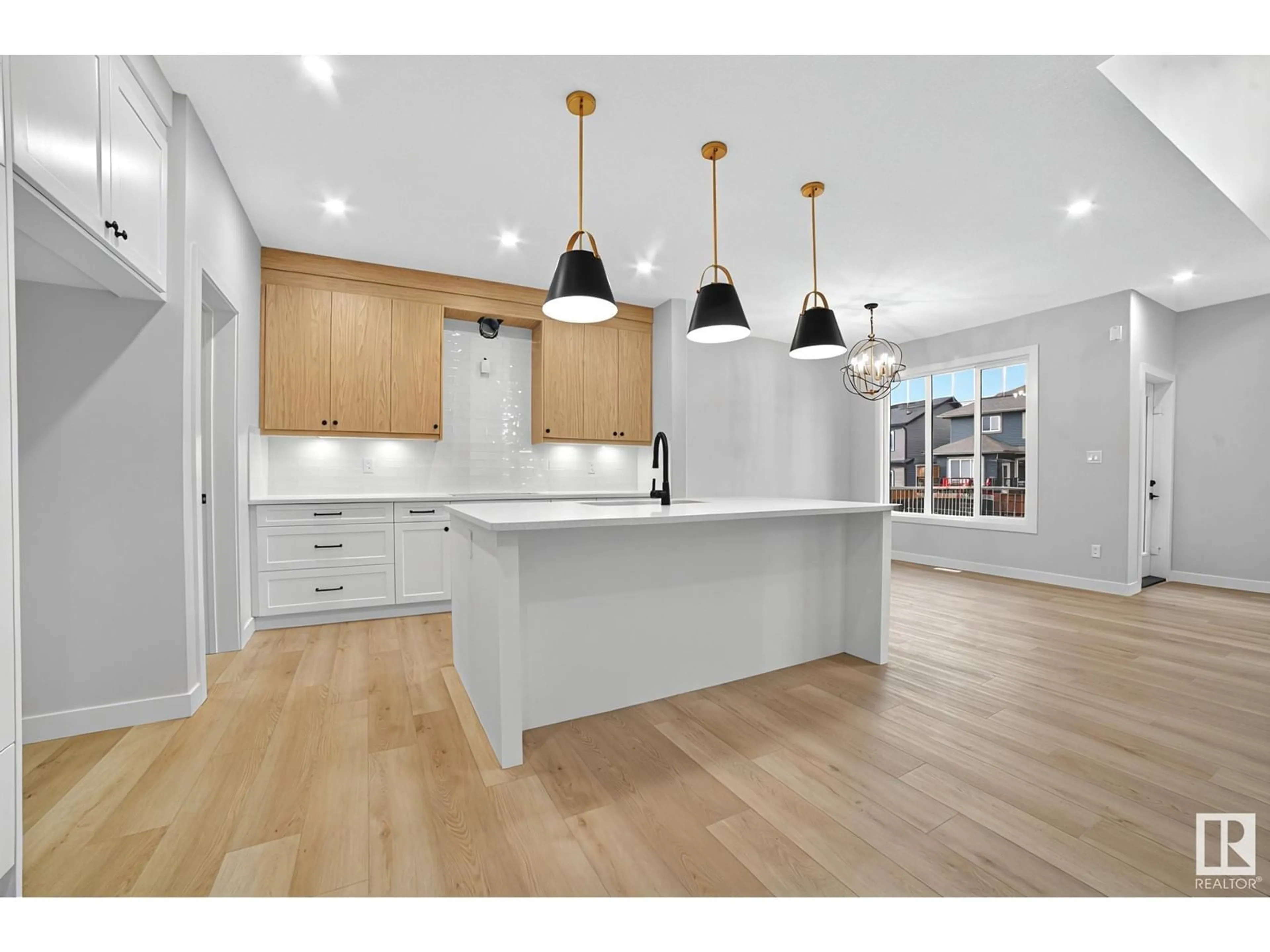Open concept kitchen, wood/laminate floor for 150 LARCH CRESCENT, Leduc Alberta T9E0S5