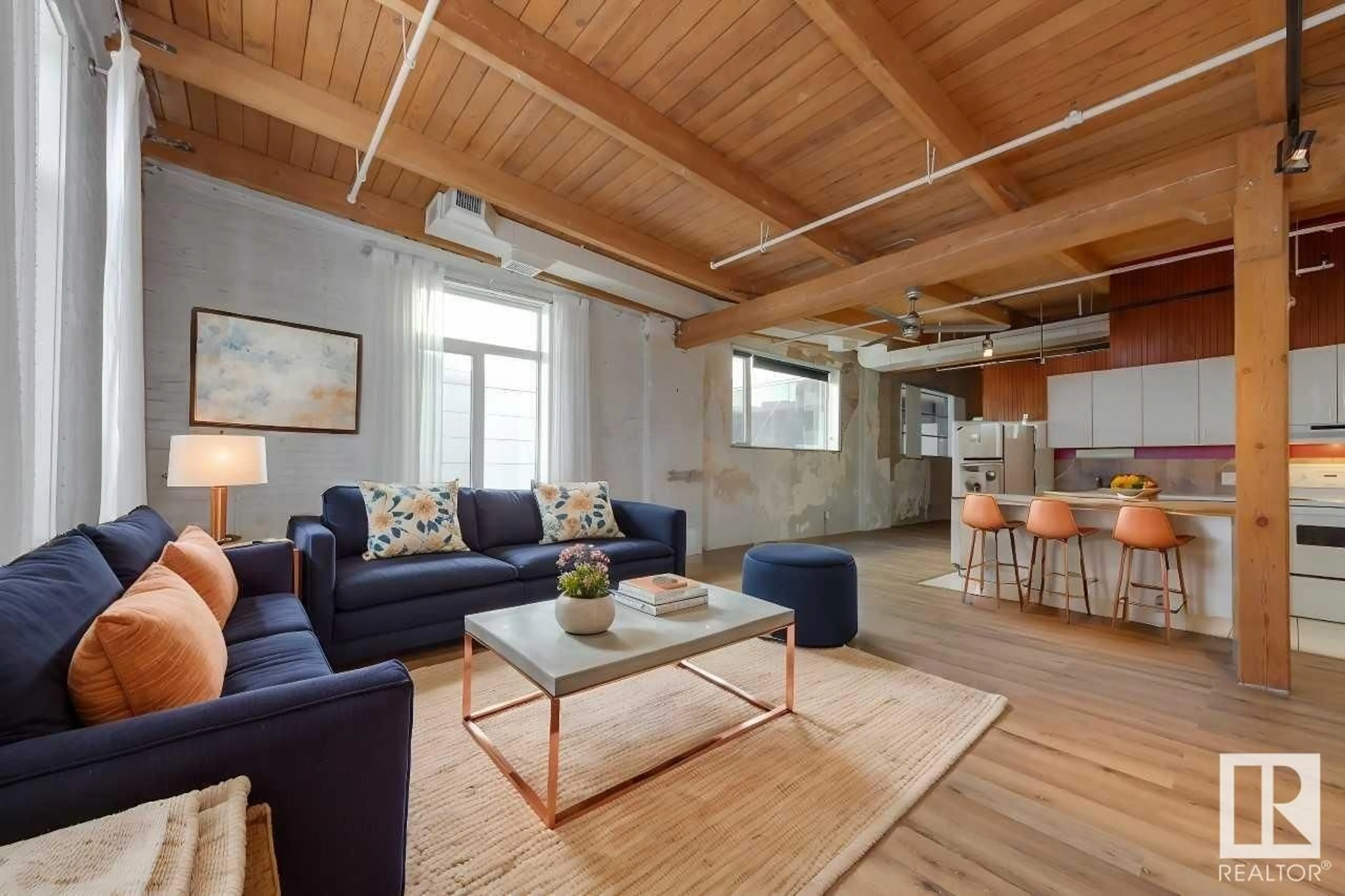 Living room with furniture, wood/laminate floor for 218 - 10309 107 ST, Edmonton Alberta T5J1K3