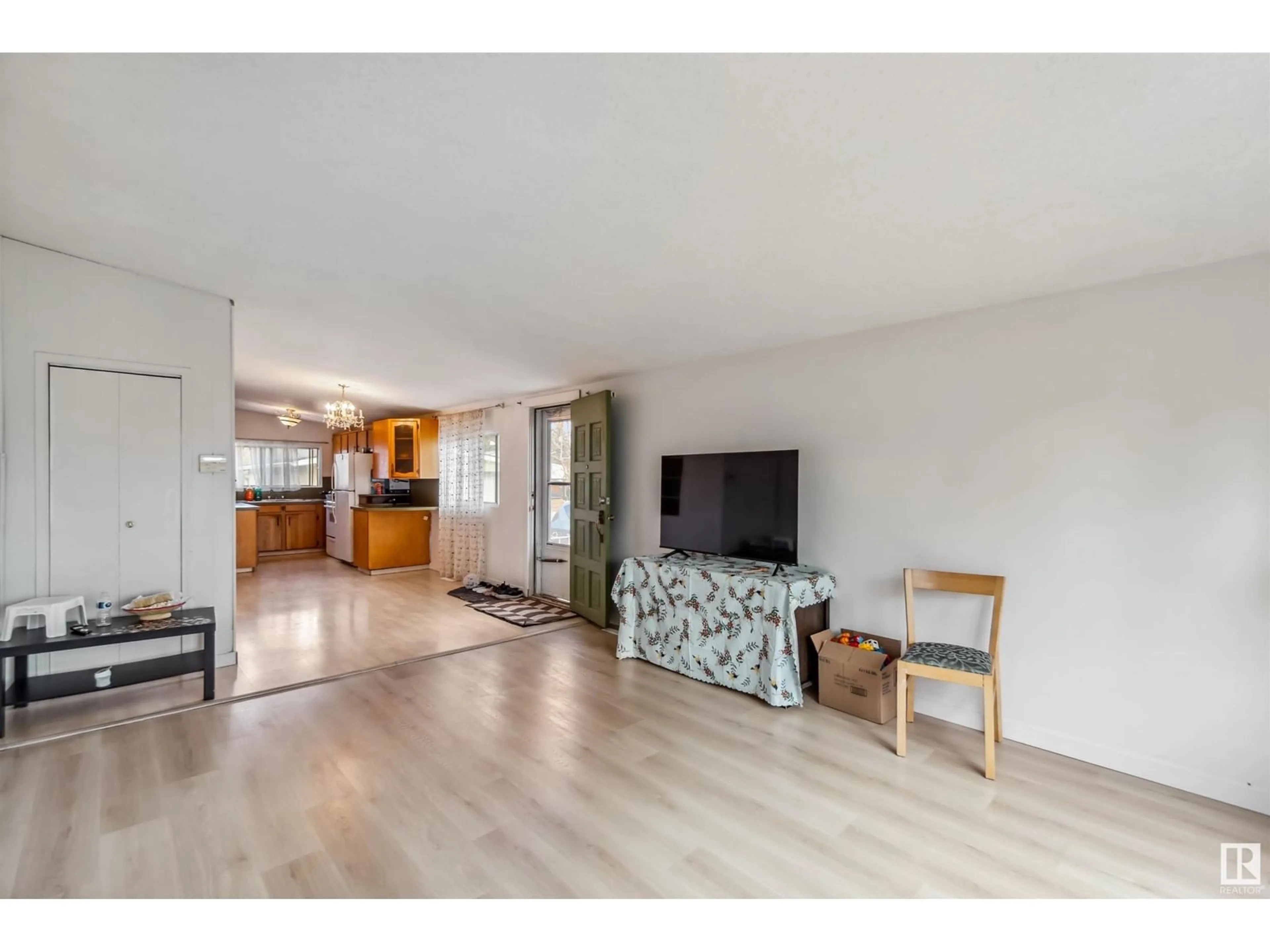 Living room with furniture, wood/laminate floor for 16314 96A AV, Edmonton Alberta T5P0E5