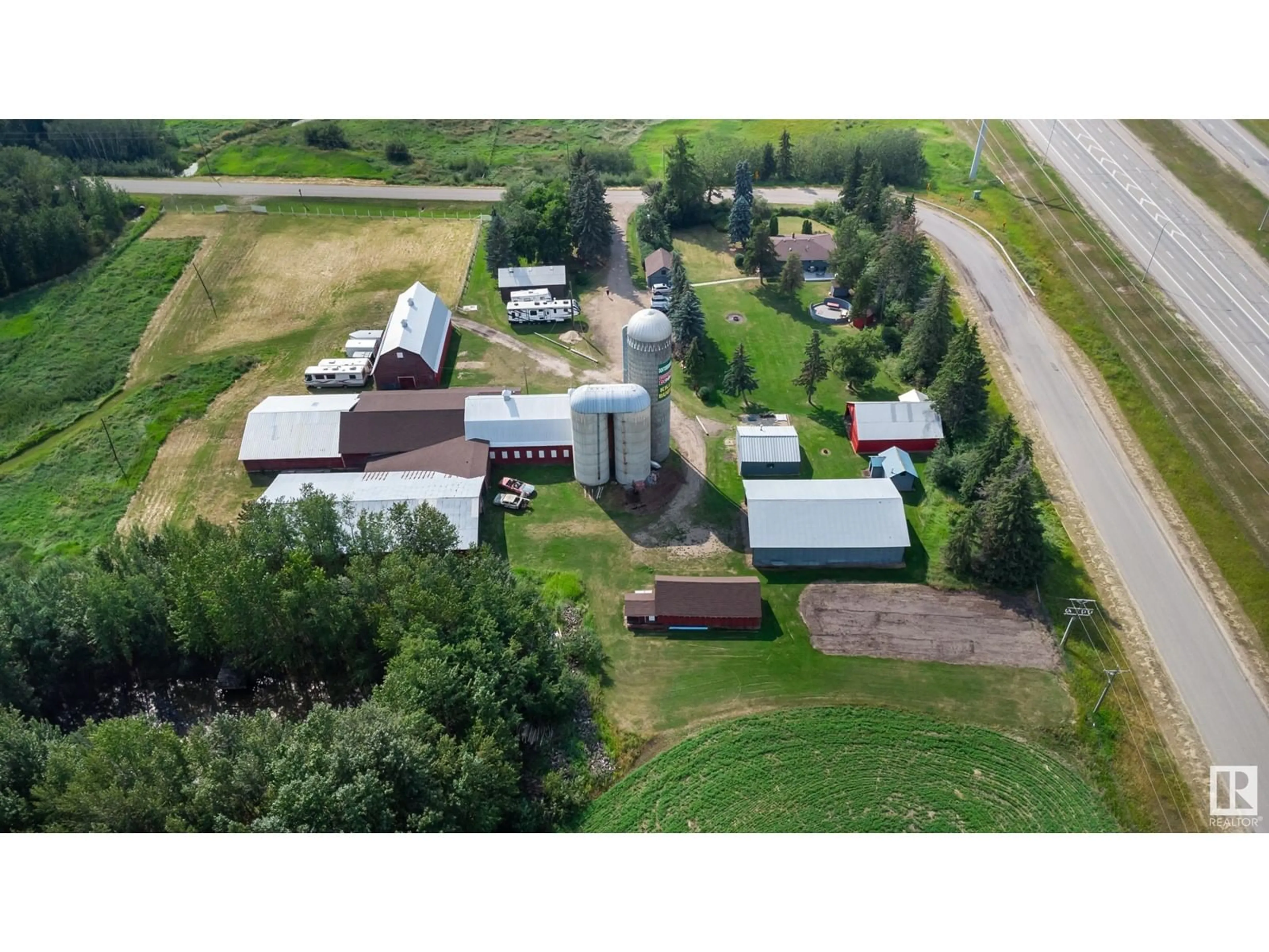 A pic from outside/outdoor area/front of a property/back of a property/a pic from drone, building for 51539 RGE ROAD 232 A, Rural Strathcona County Alberta T8B1L1