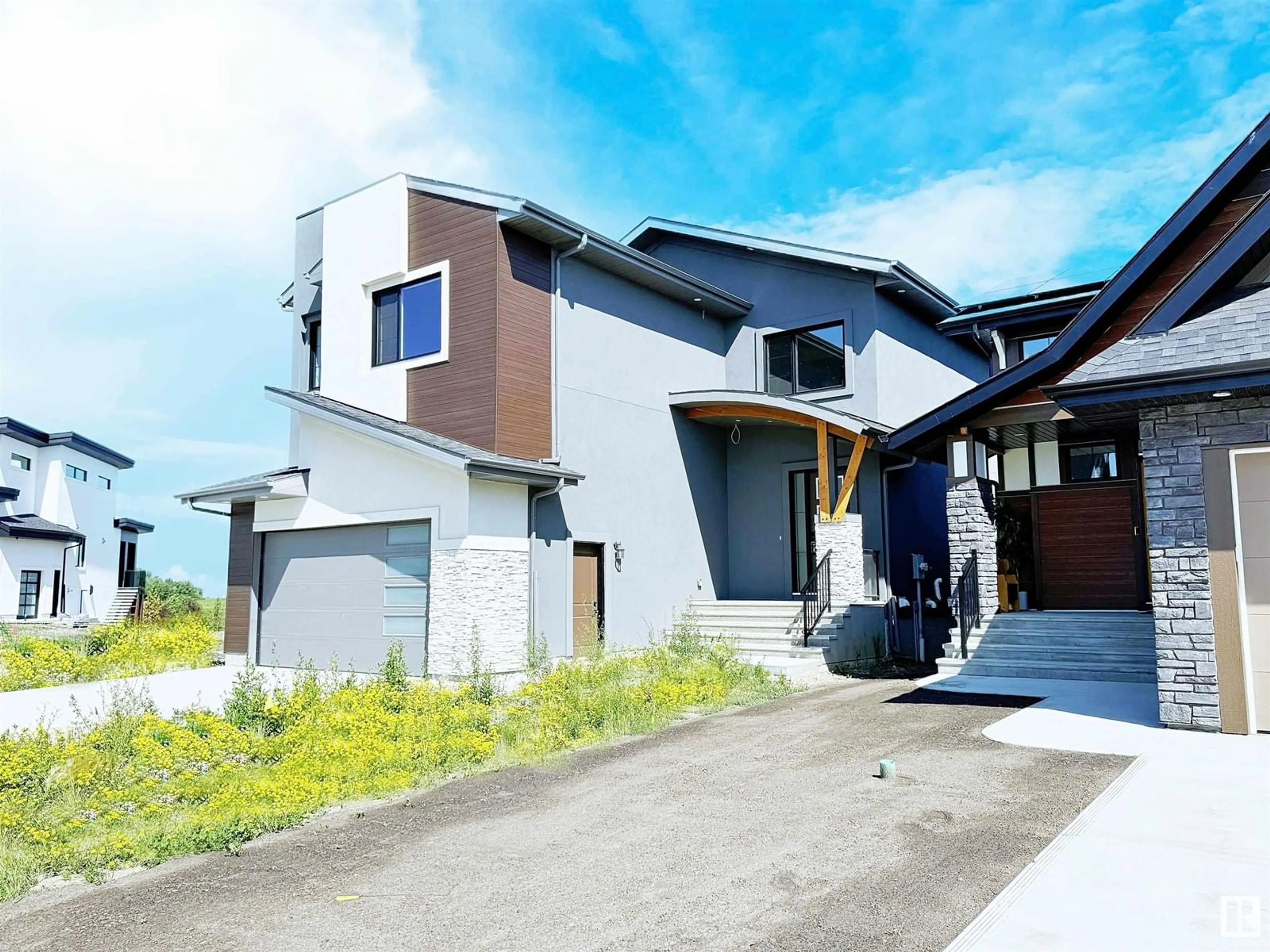 Home with vinyl exterior material, street for 162 EDGEWATER CI, Leduc Alberta T9E1K5